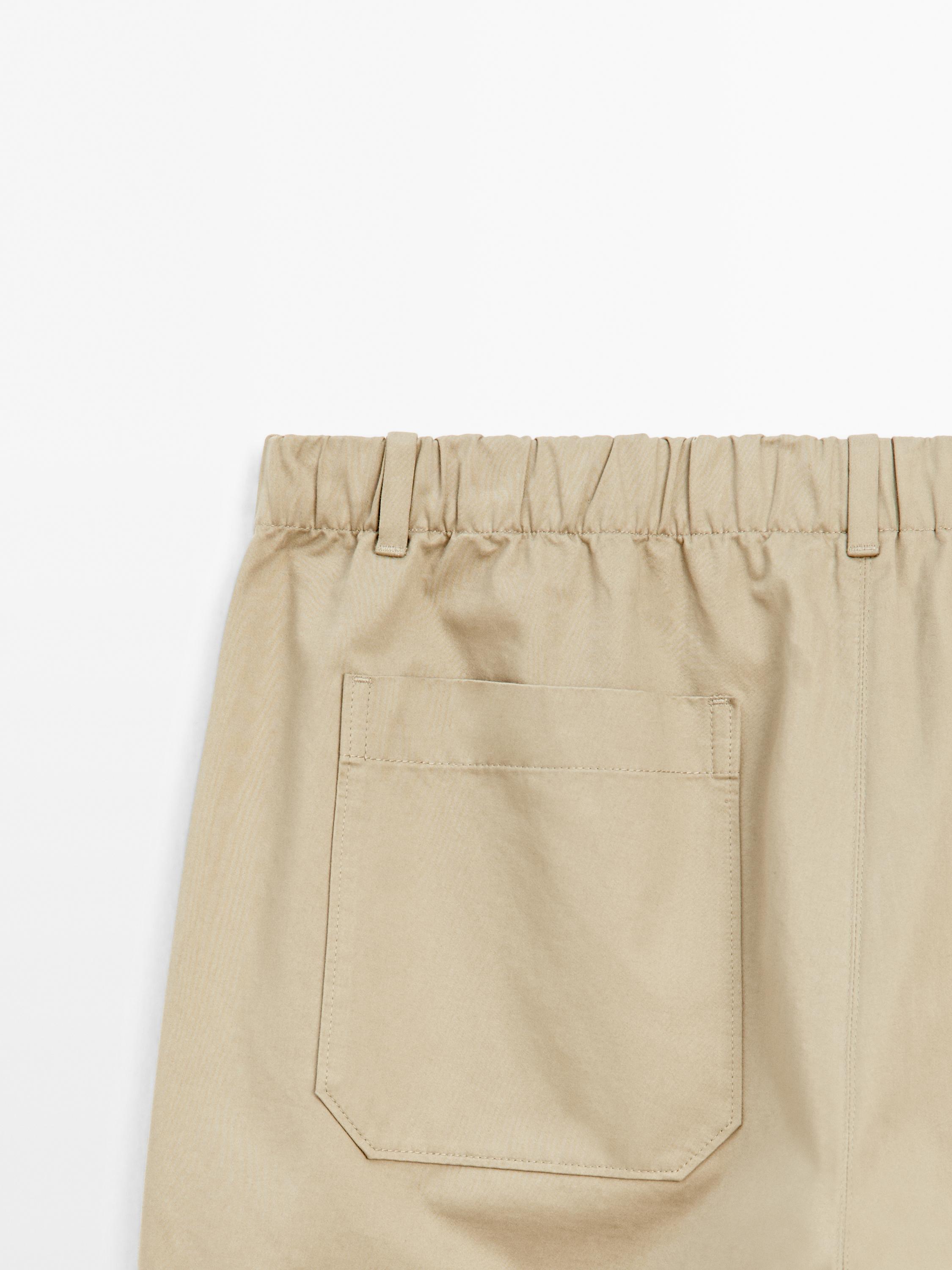 Trousers with patch pocket