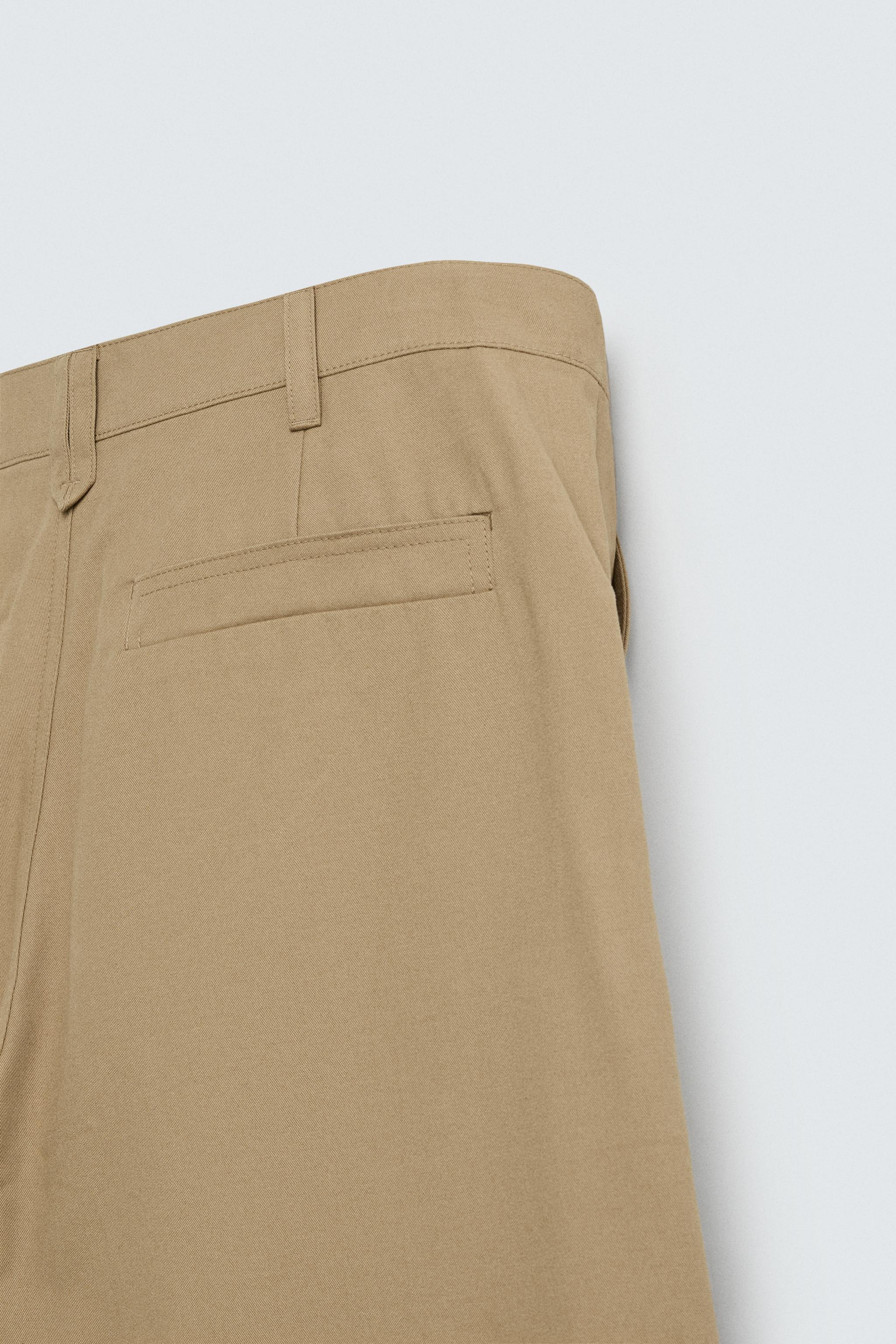 PLEATED WIDE FIT PANTS