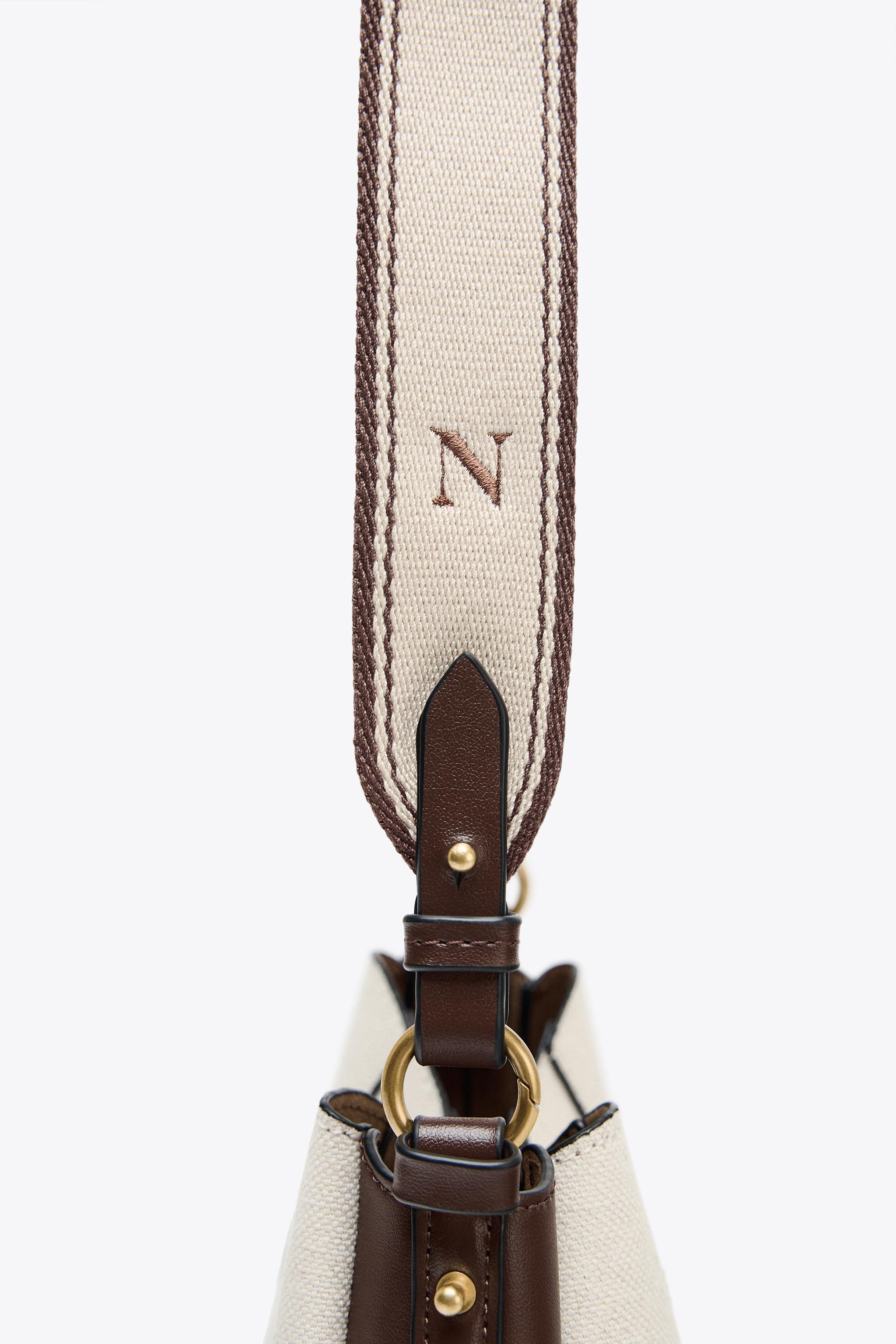 TOPSTITCHED BUCKET BAG