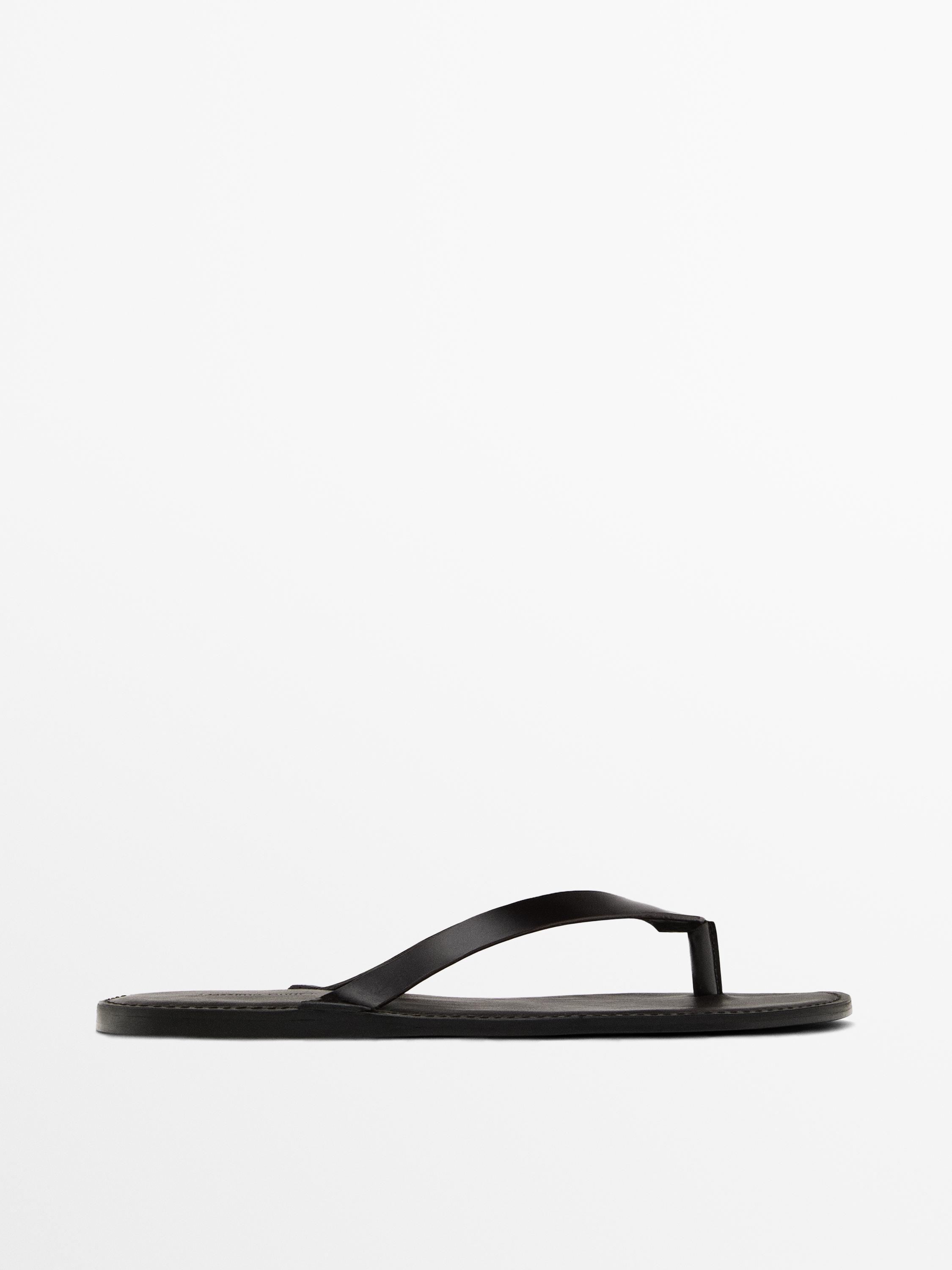 Leather sandals with toe divider
