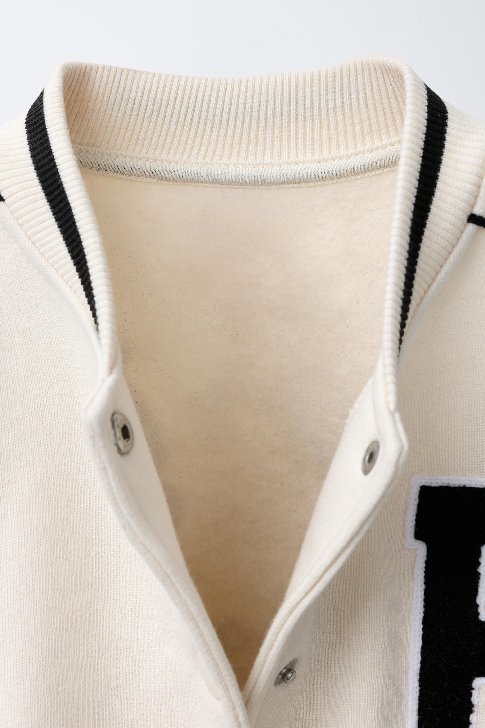 PLUSH BOMBER JACKET WITH EMBROIDERED TEXT