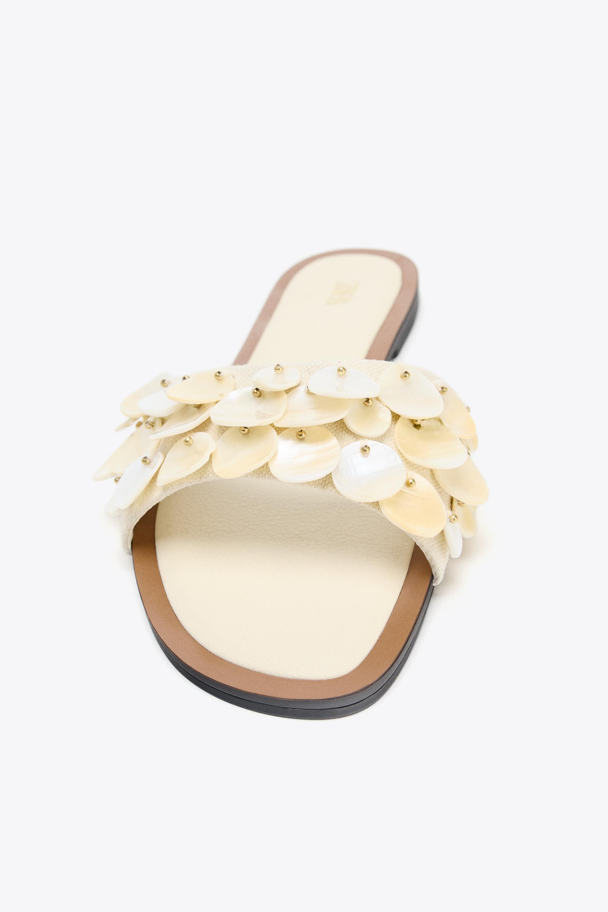 FLAT SANDALS WITH PEARLESCENT PIECES