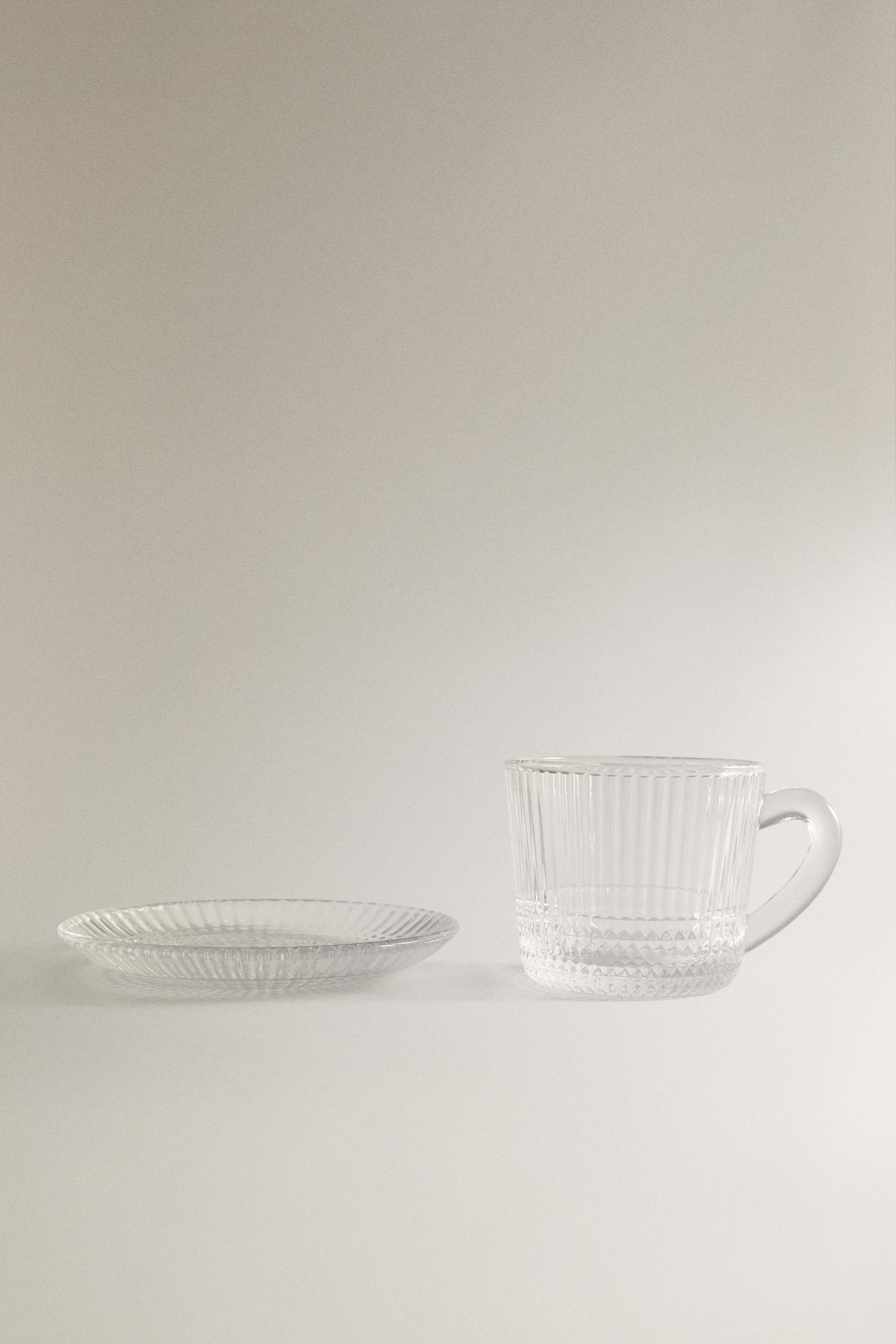 COFFEE CUP AND SAUCER WITH RAISED GEOMETRIC DESIGN