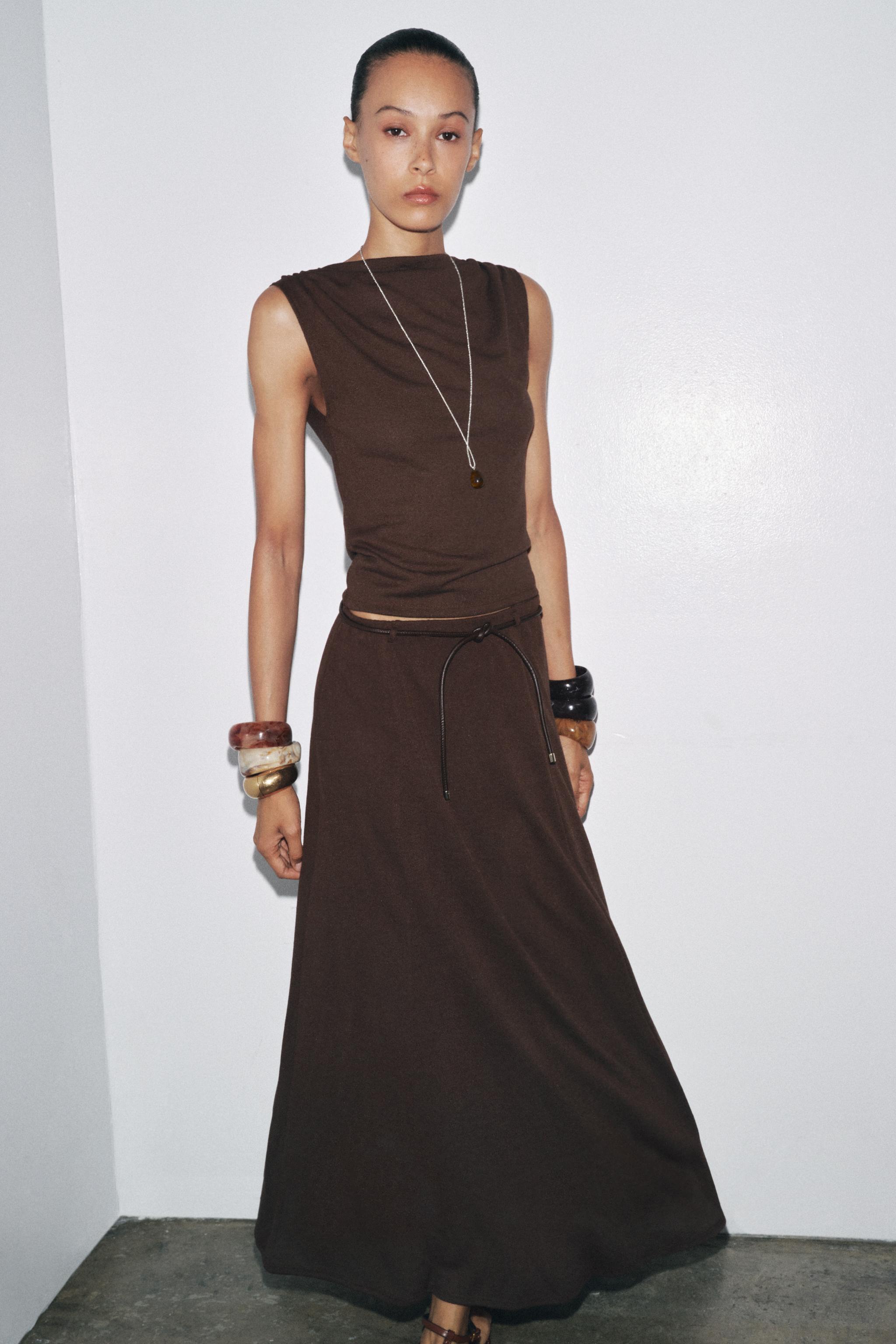 CUT-OUT KNIT SKIRT WITH BELT