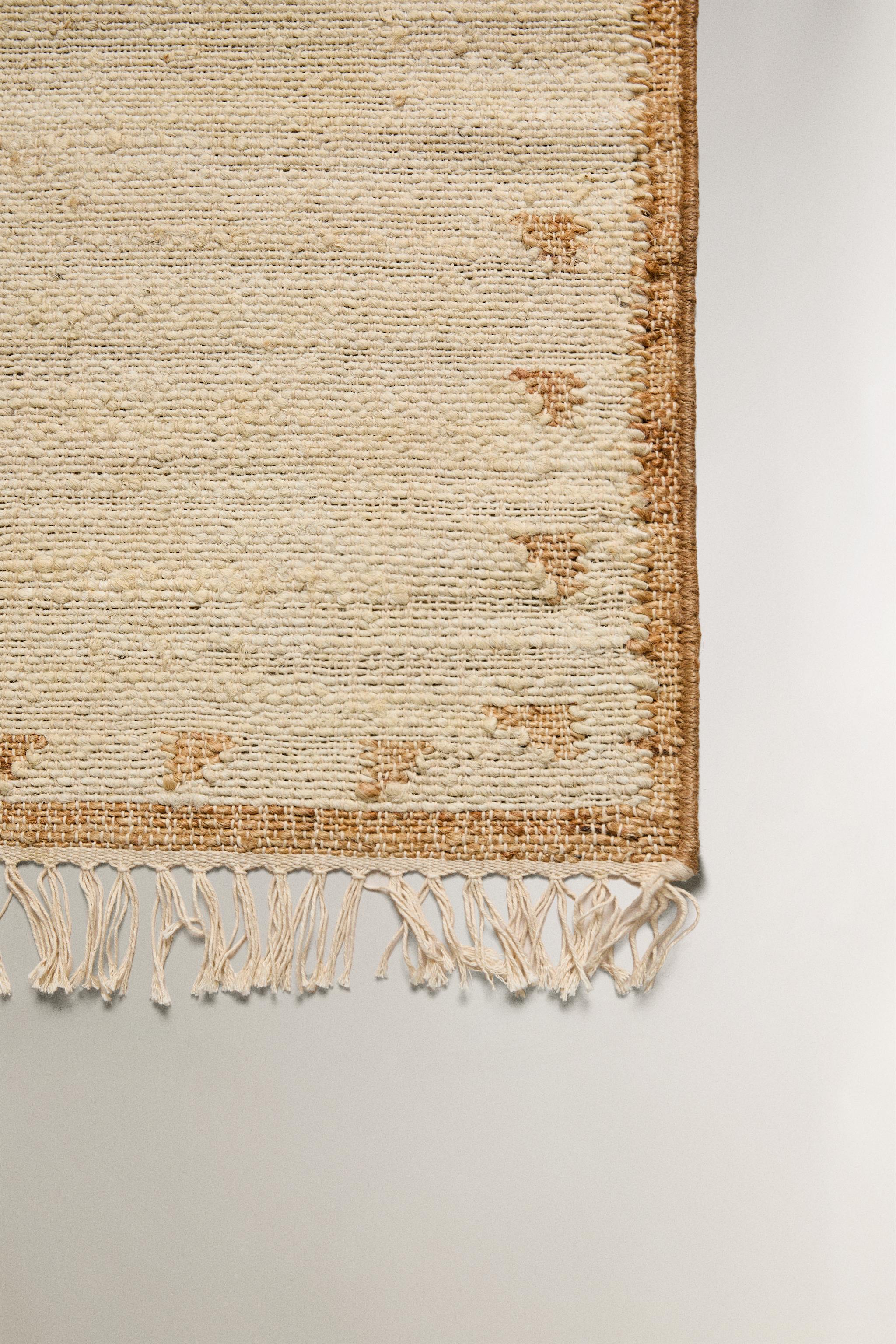 JUTE AND COTTON AREA RUG WITH FRINGING