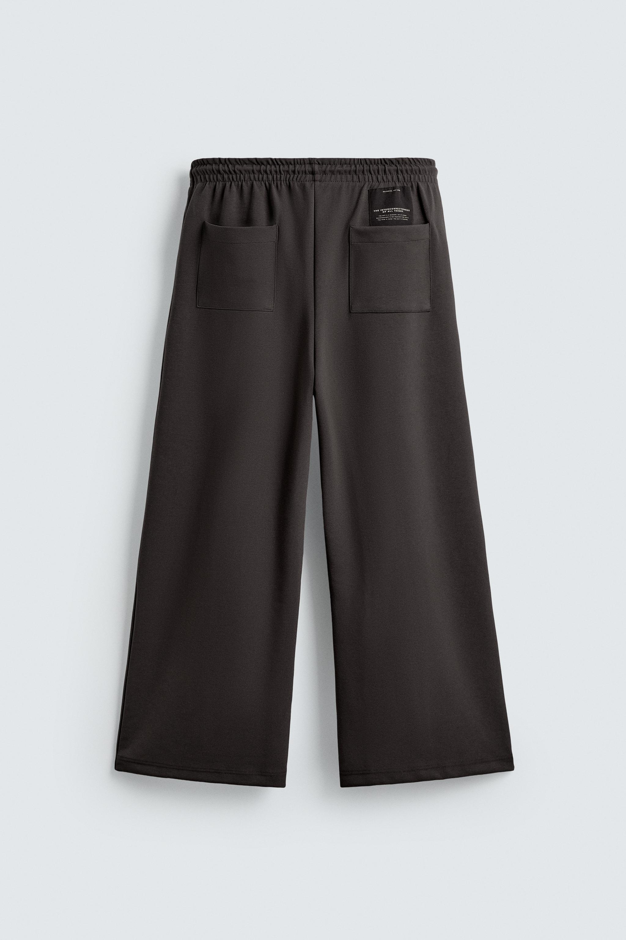 INTERLOCK PLEATED LABEL PANTS