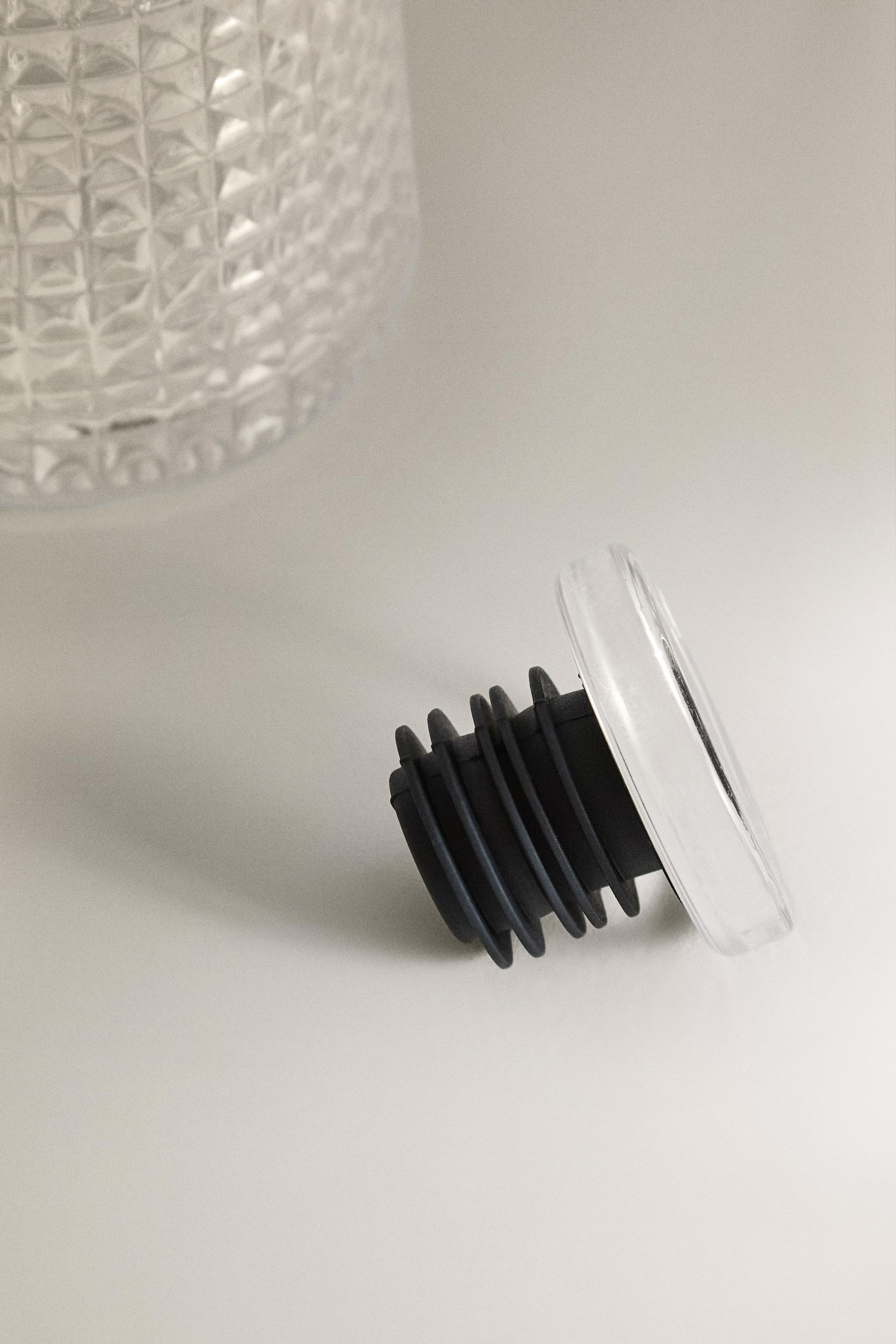 RAISED DESIGN GLASS BOTTLE