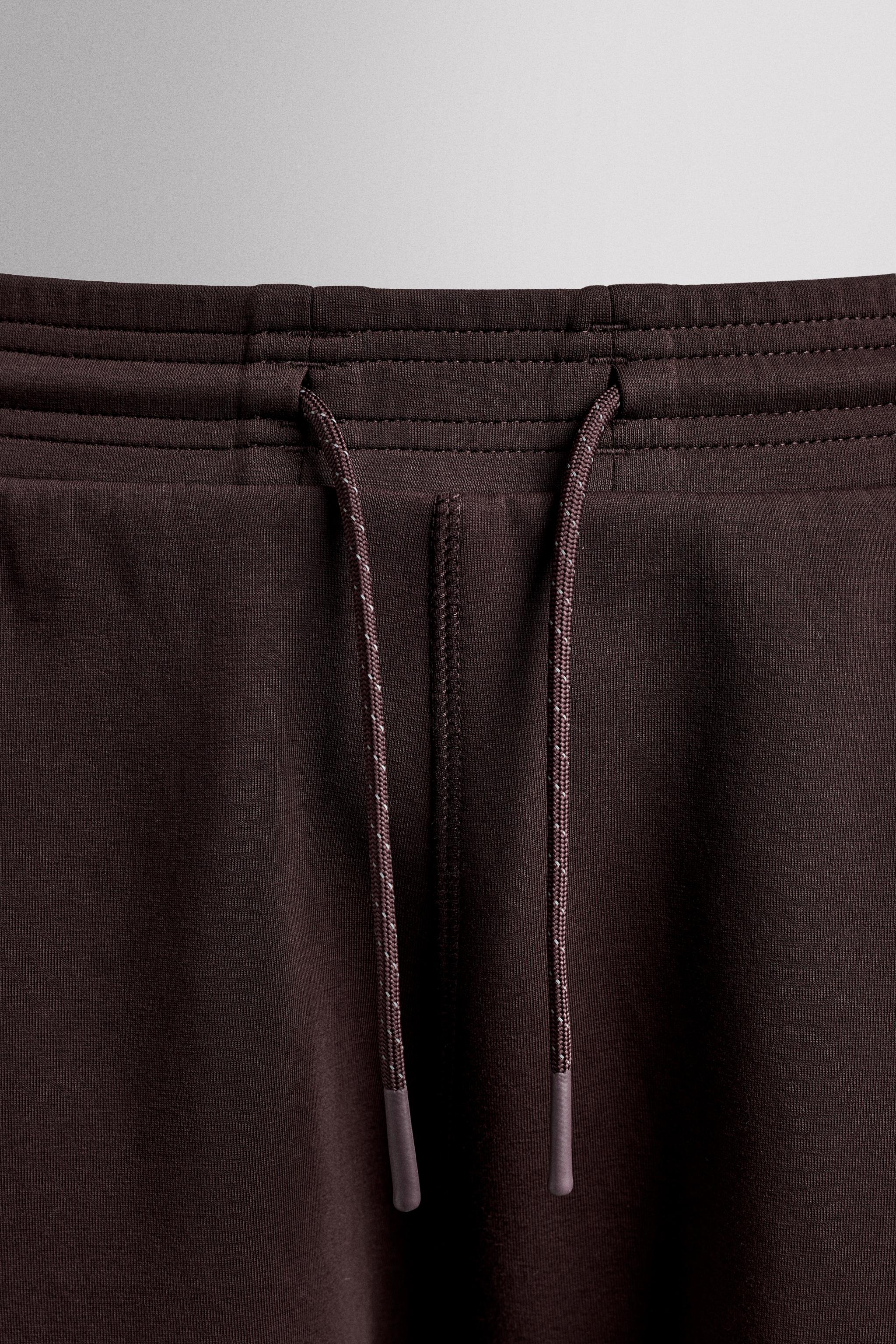 TECHNICAL ZIPPER PANTS
