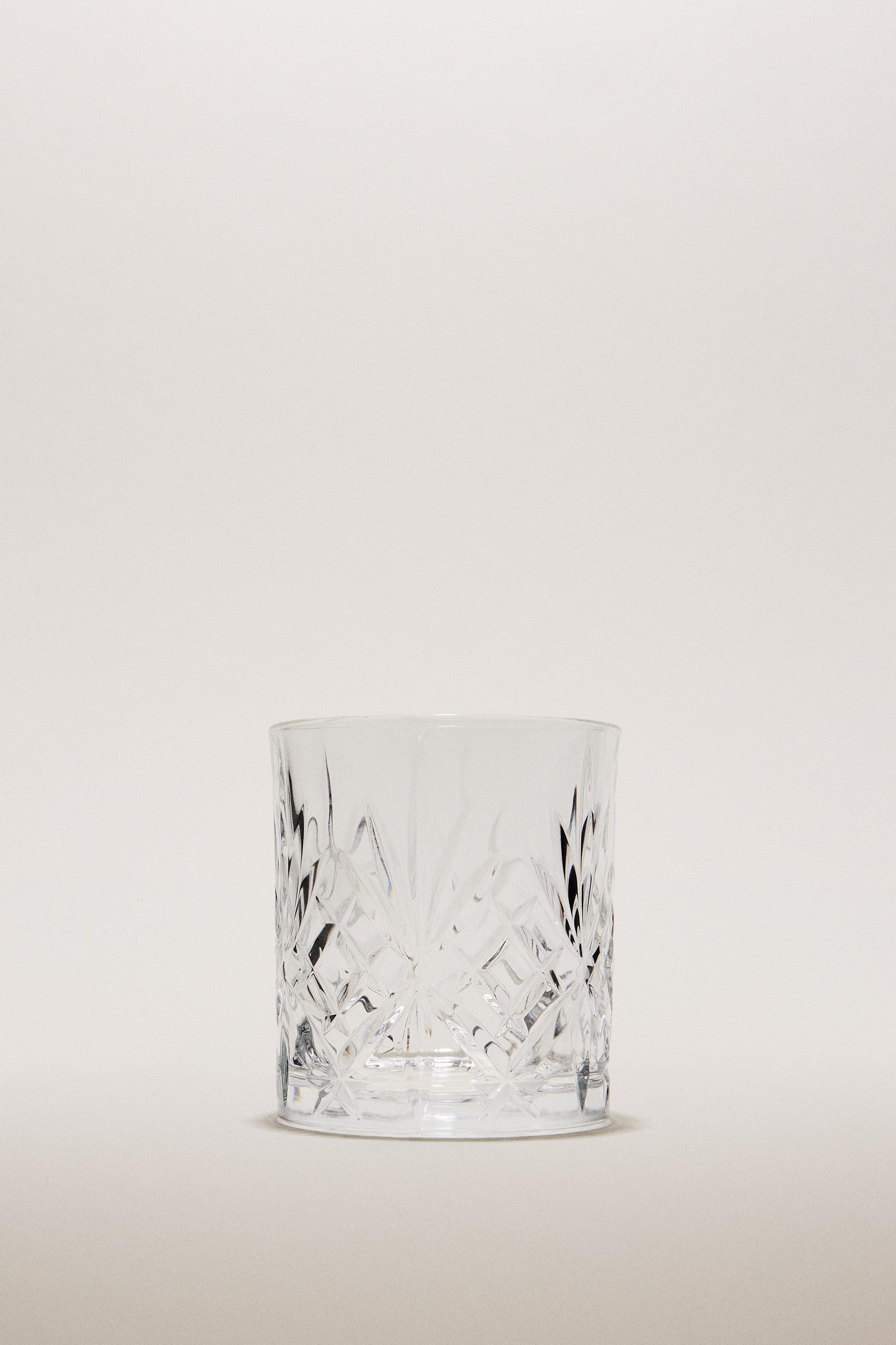CRYSTALLINE TUMBLER WITH RAISED DESIGN