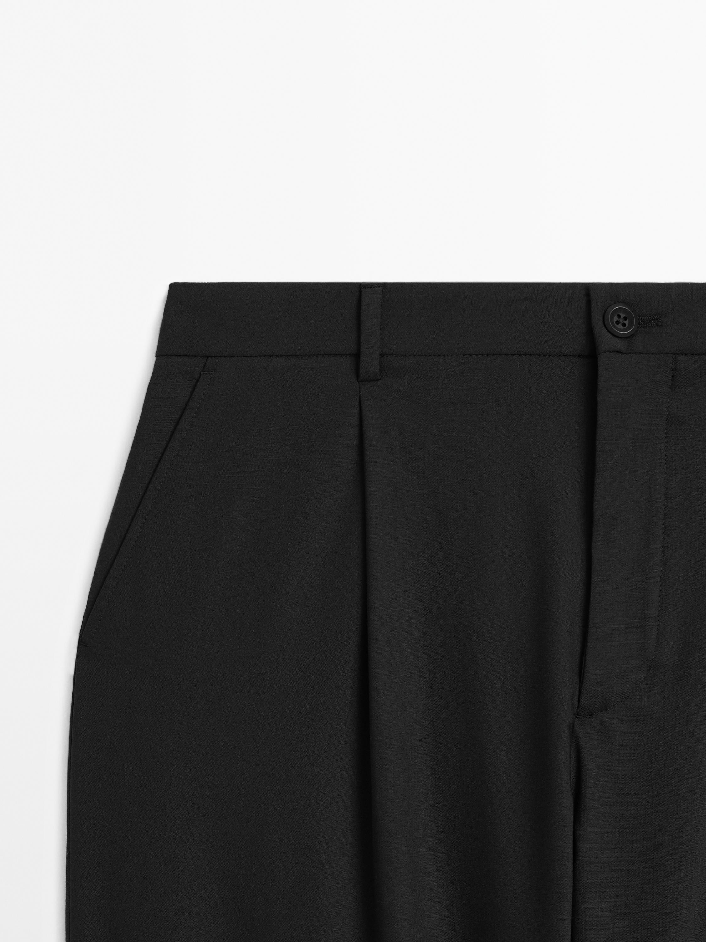 Relaxed fit trousers with darts