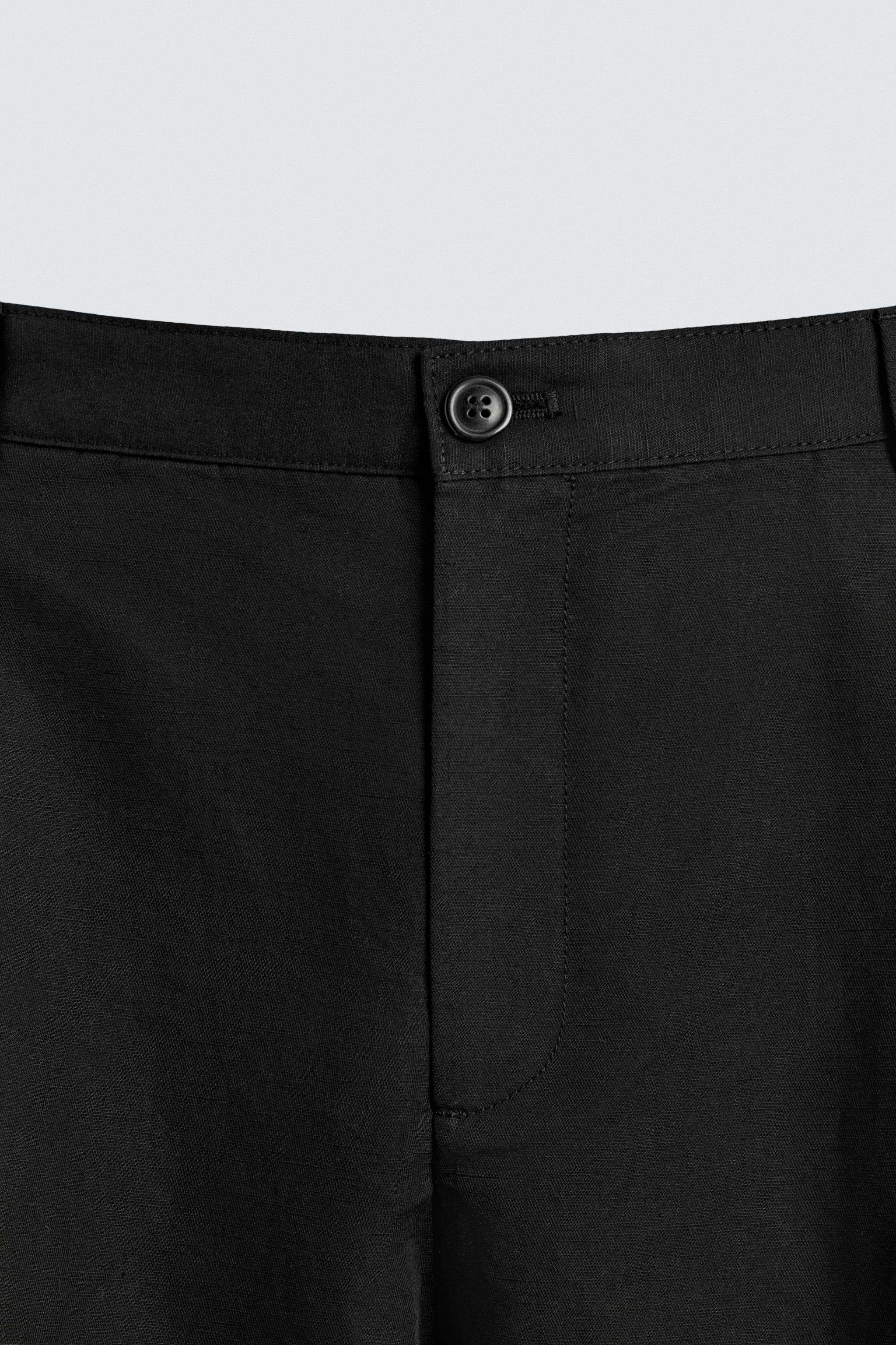 RELAXED FIT PLEATED PANTS