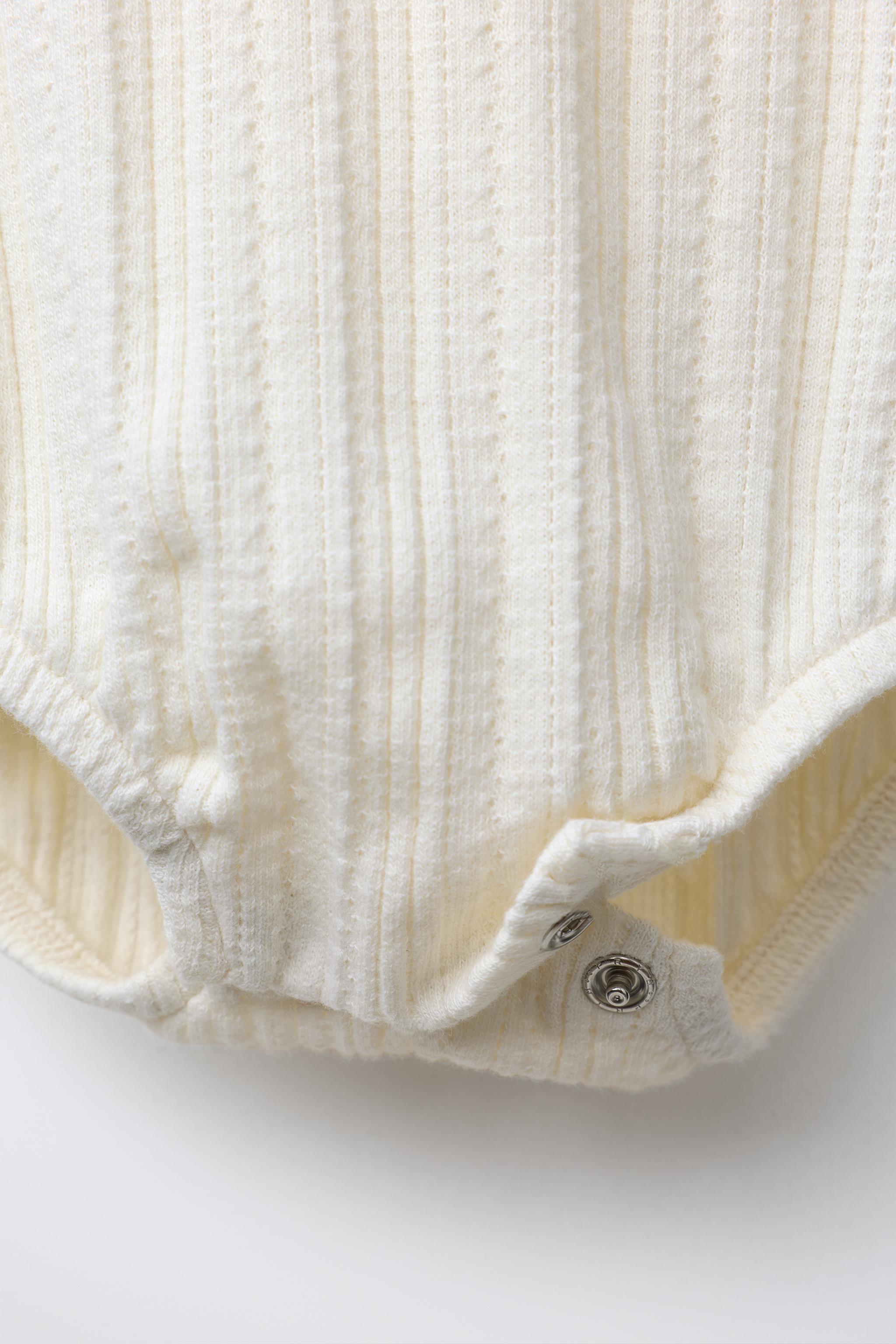 PRINTED POINTELLE BODYSUIT