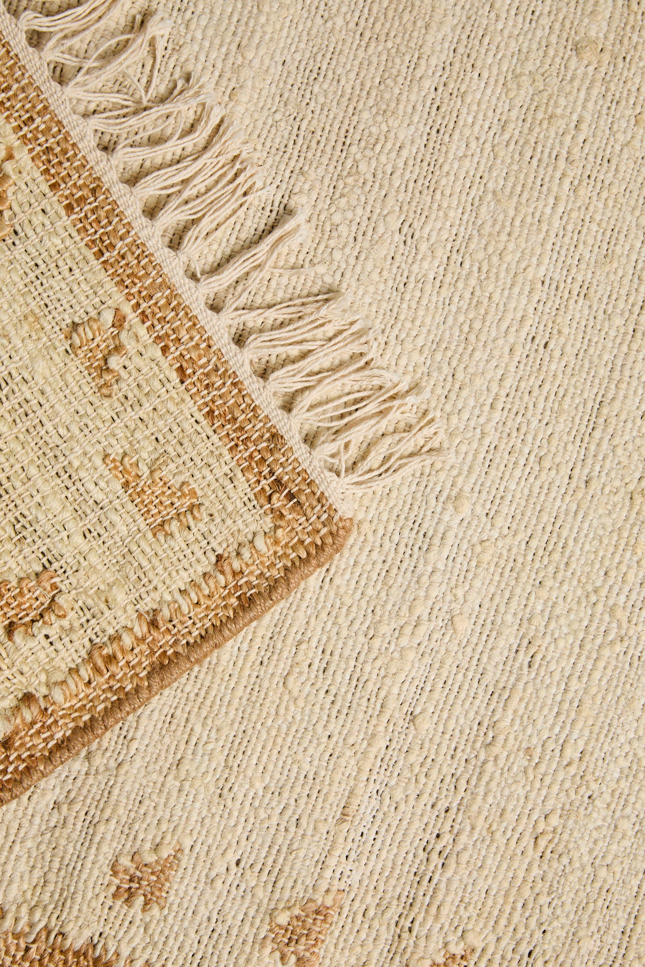JUTE AND COTTON AREA RUG WITH FRINGING