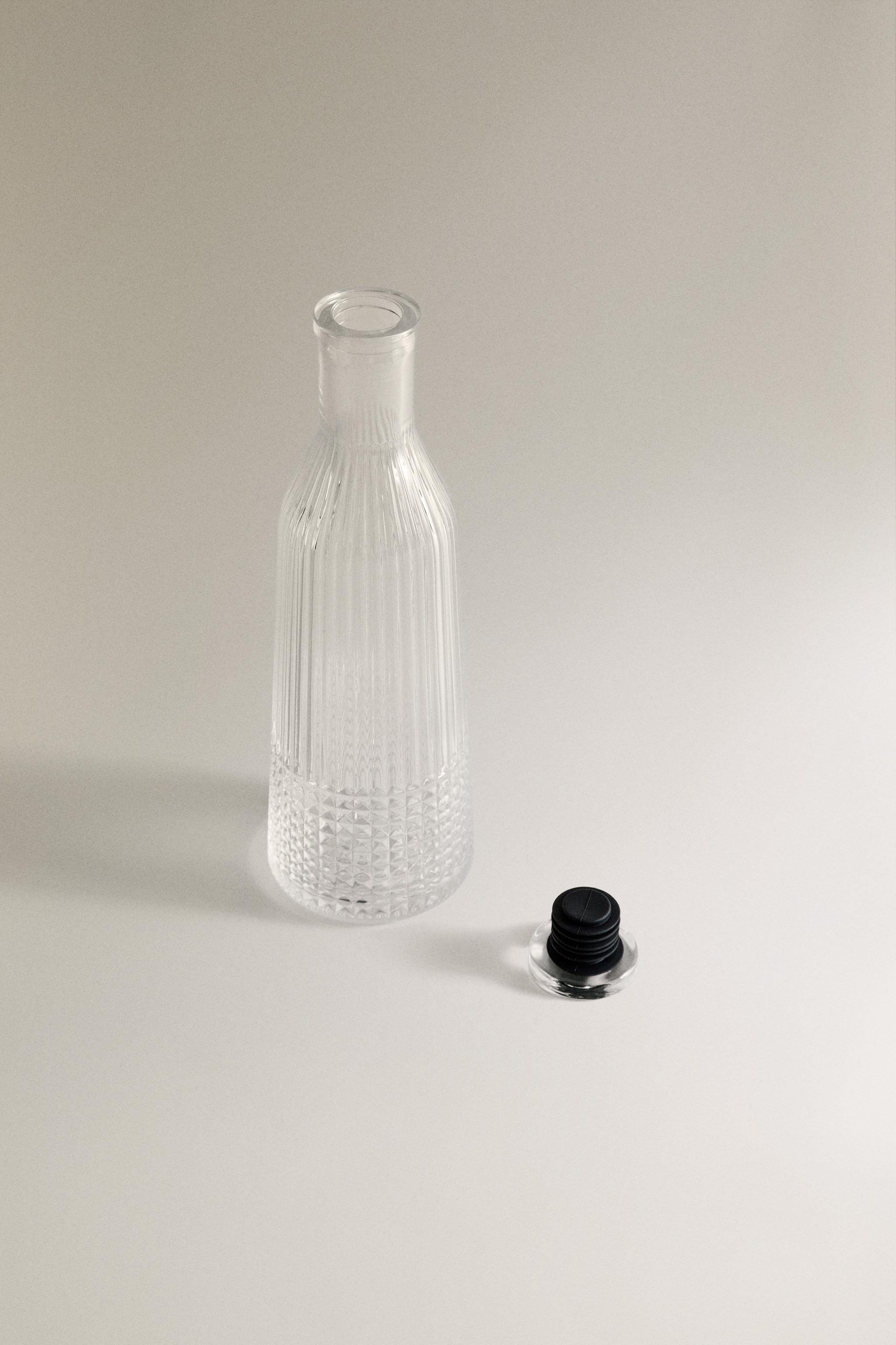 RAISED DESIGN GLASS BOTTLE
