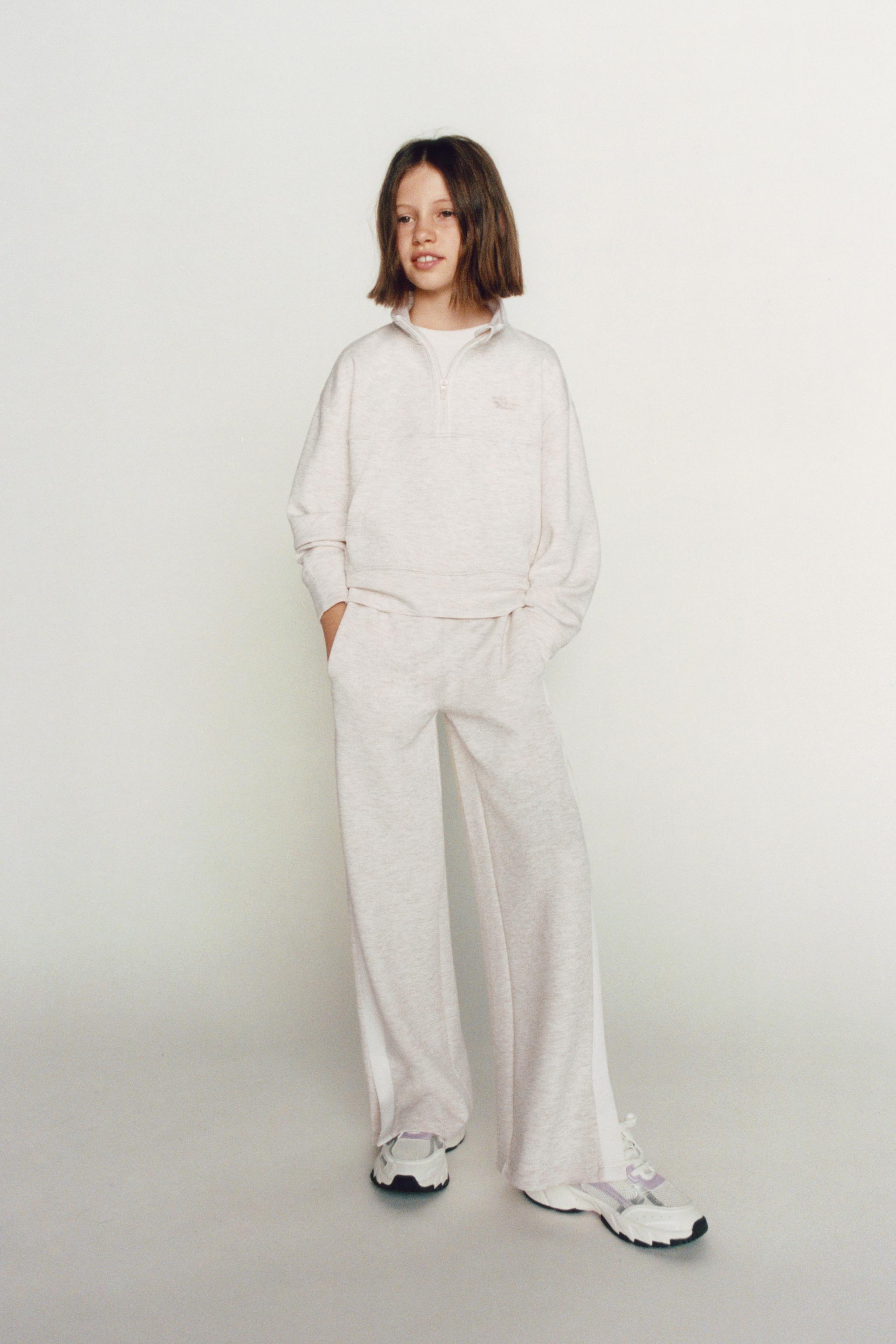 RAISED TEXT SWEATSHIRT