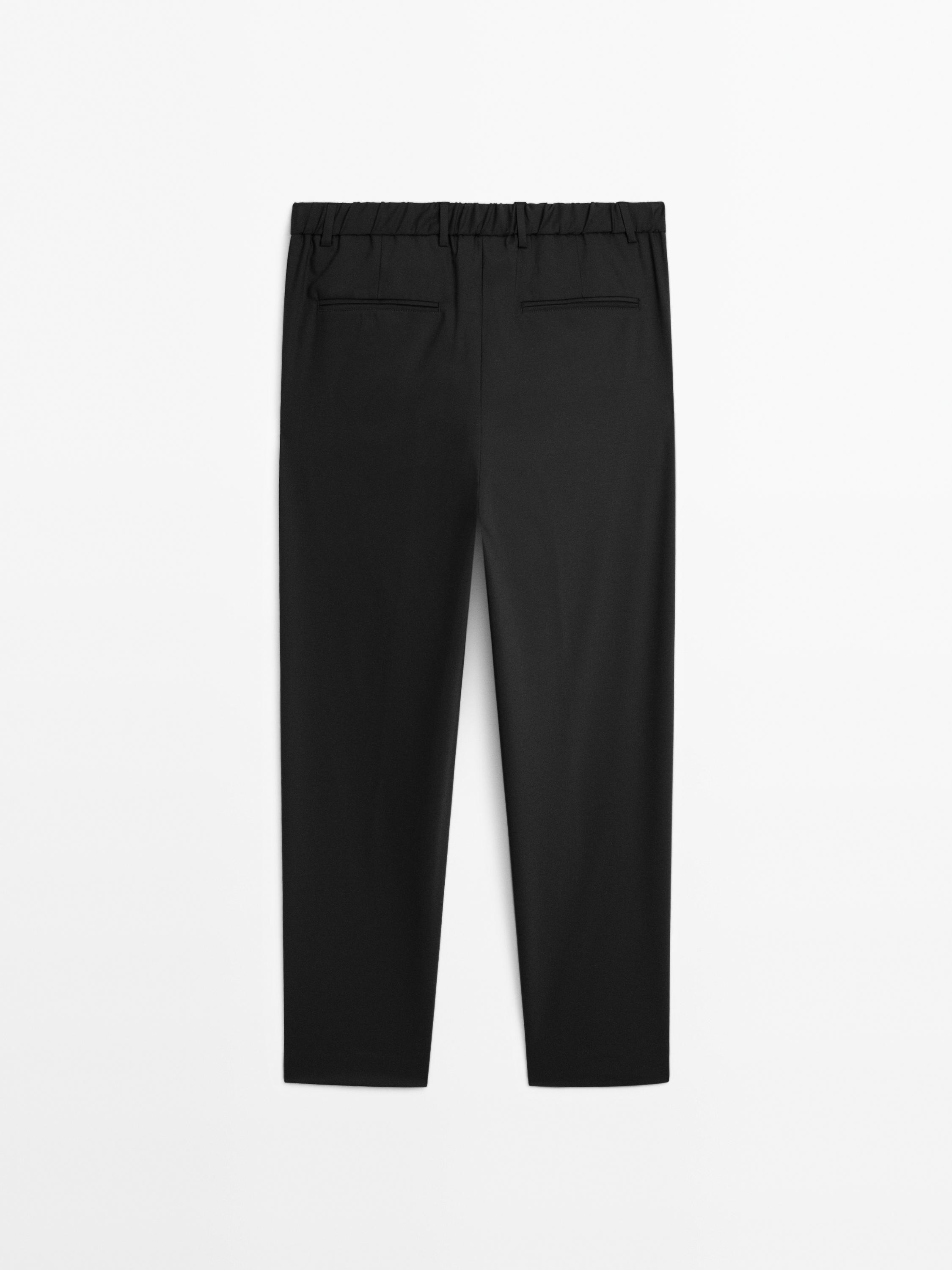 Relaxed fit trousers with darts