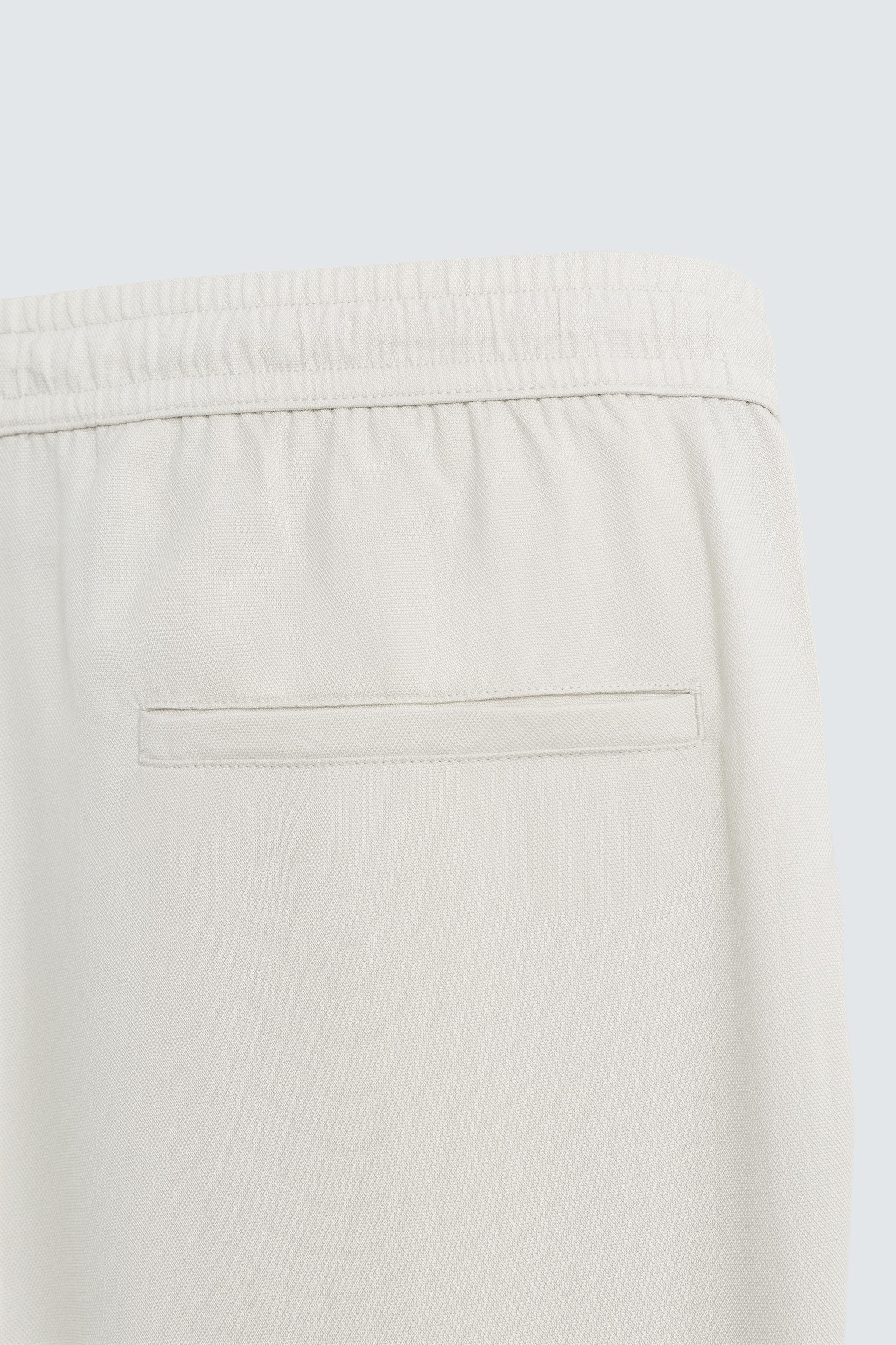 RELAXED FIT FLOWY PANTS