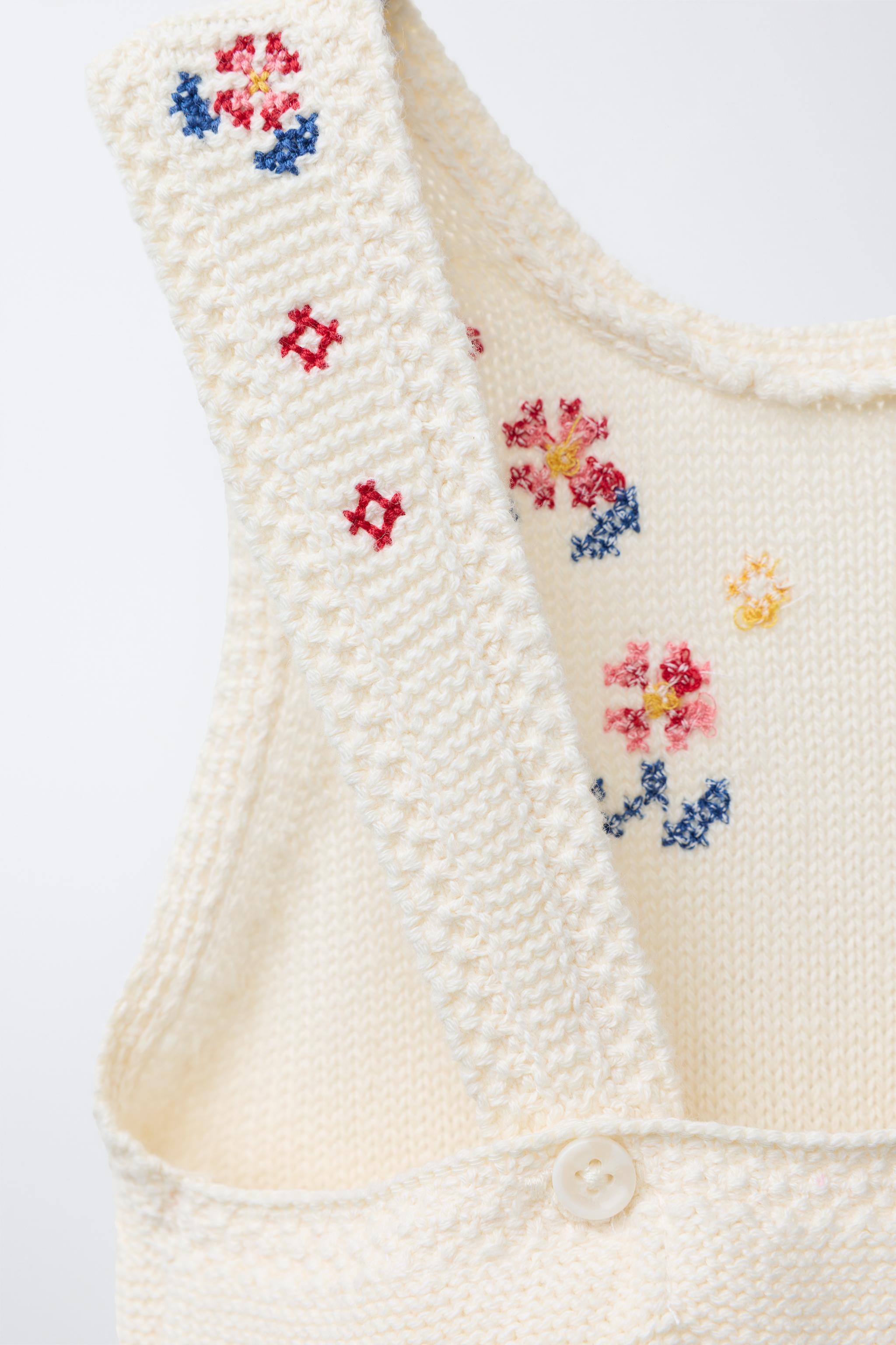LONG KNIT OVERALLS WITH CROSS-STITCH DETAILS