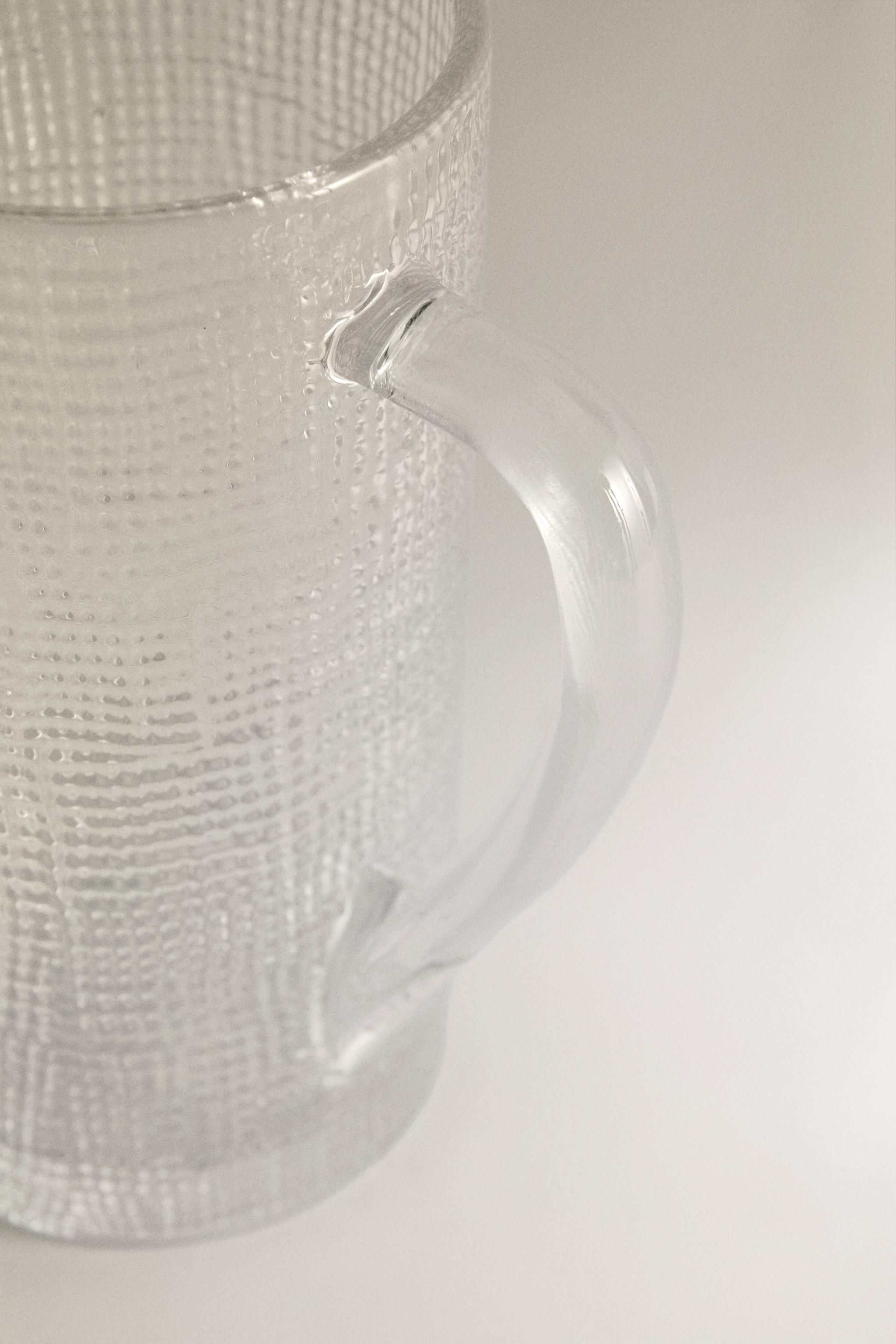RAISED DESIGN GLASS PITCHER