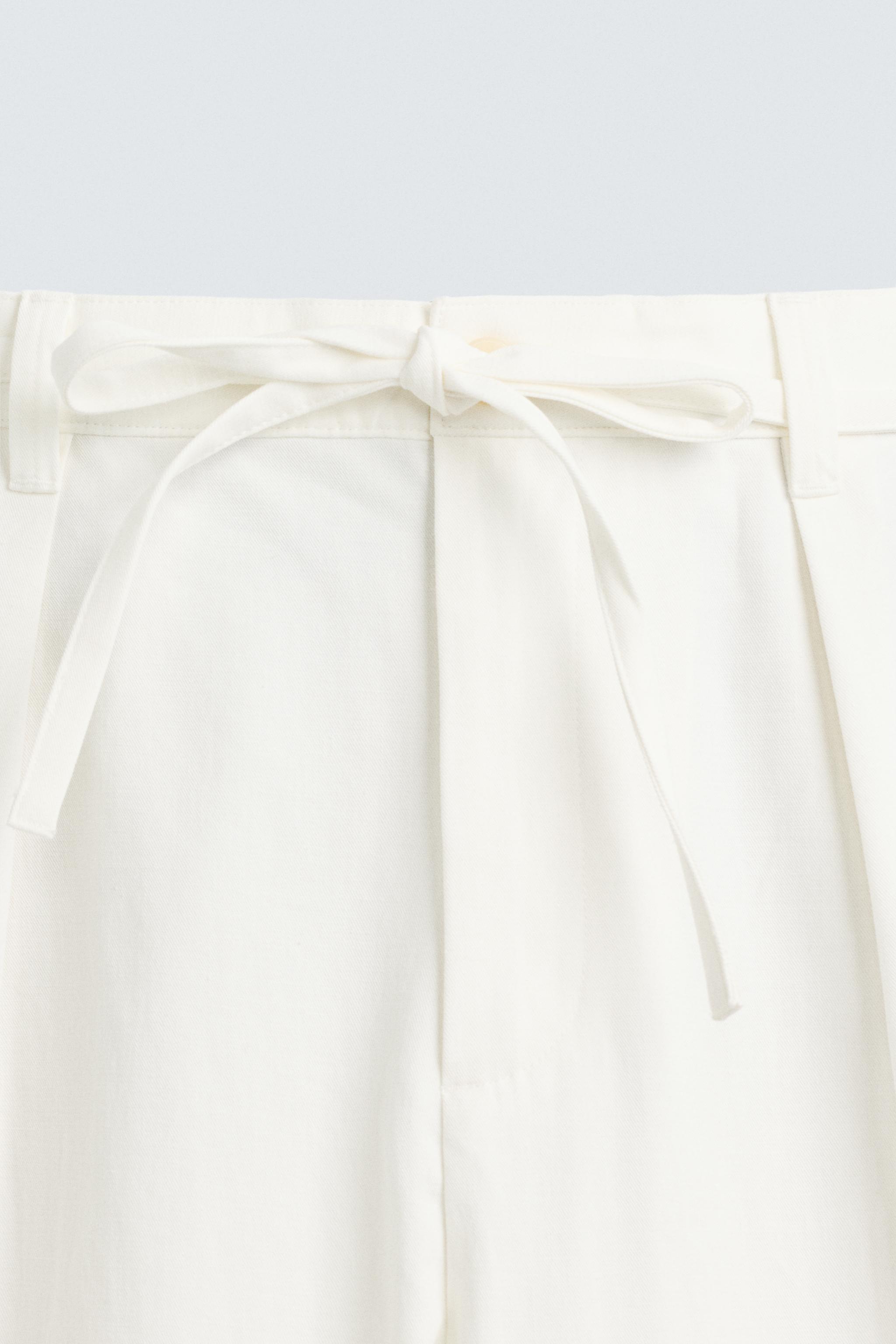 RELAXED FIT PLEATED PANTS