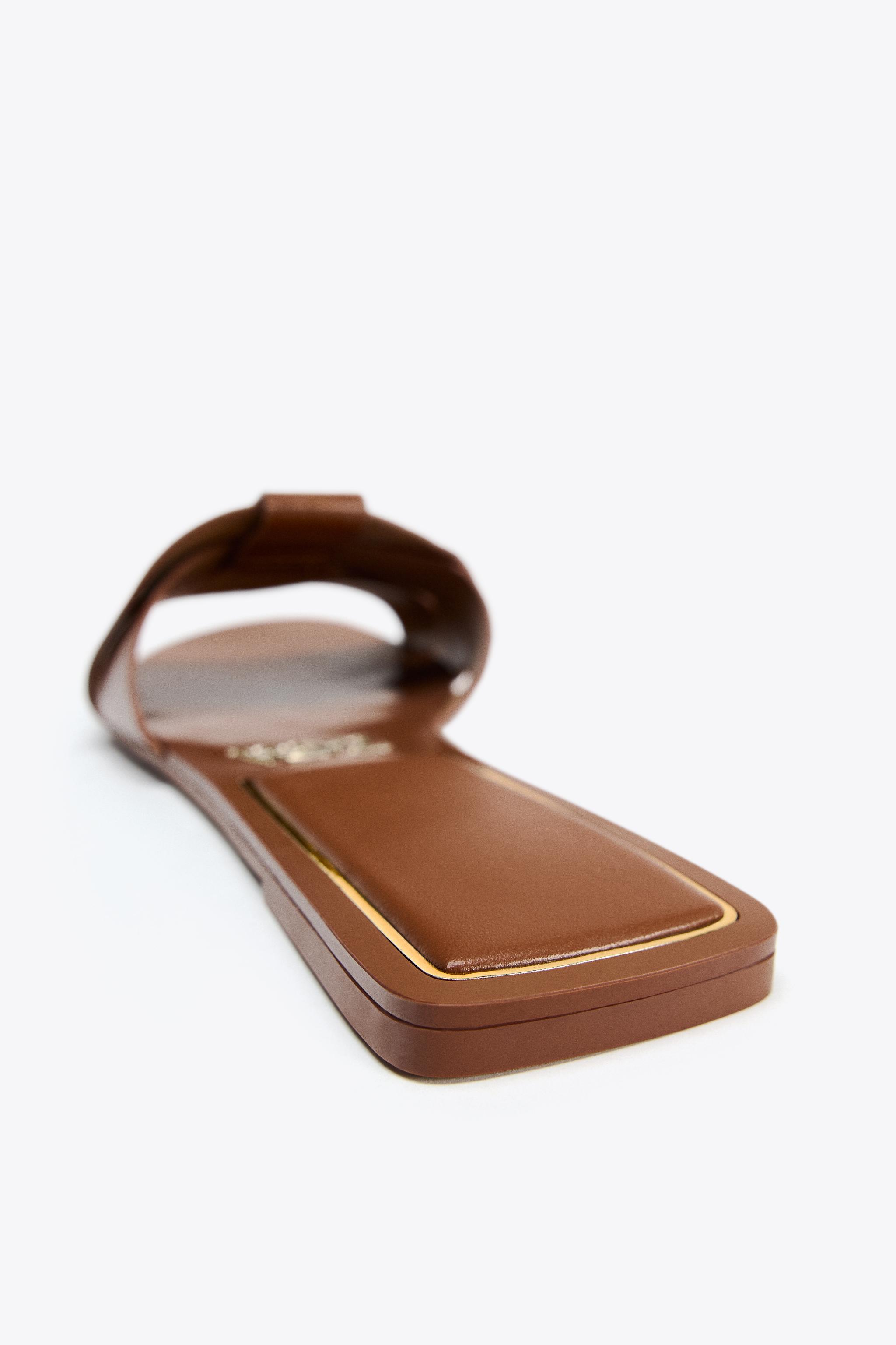 FLAT CROSSED LEATHER SANDALS