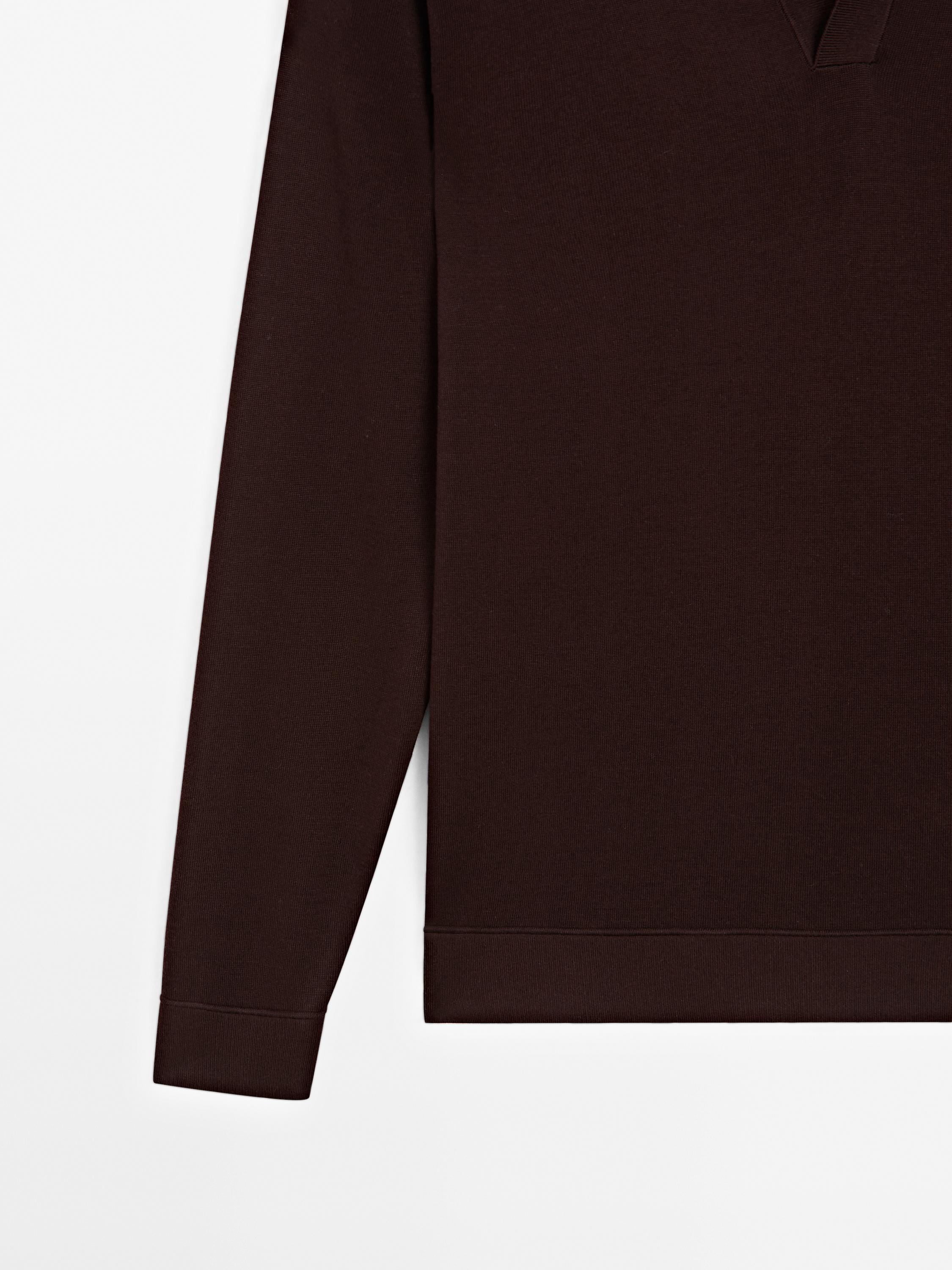 Knit sweater with a polo collar