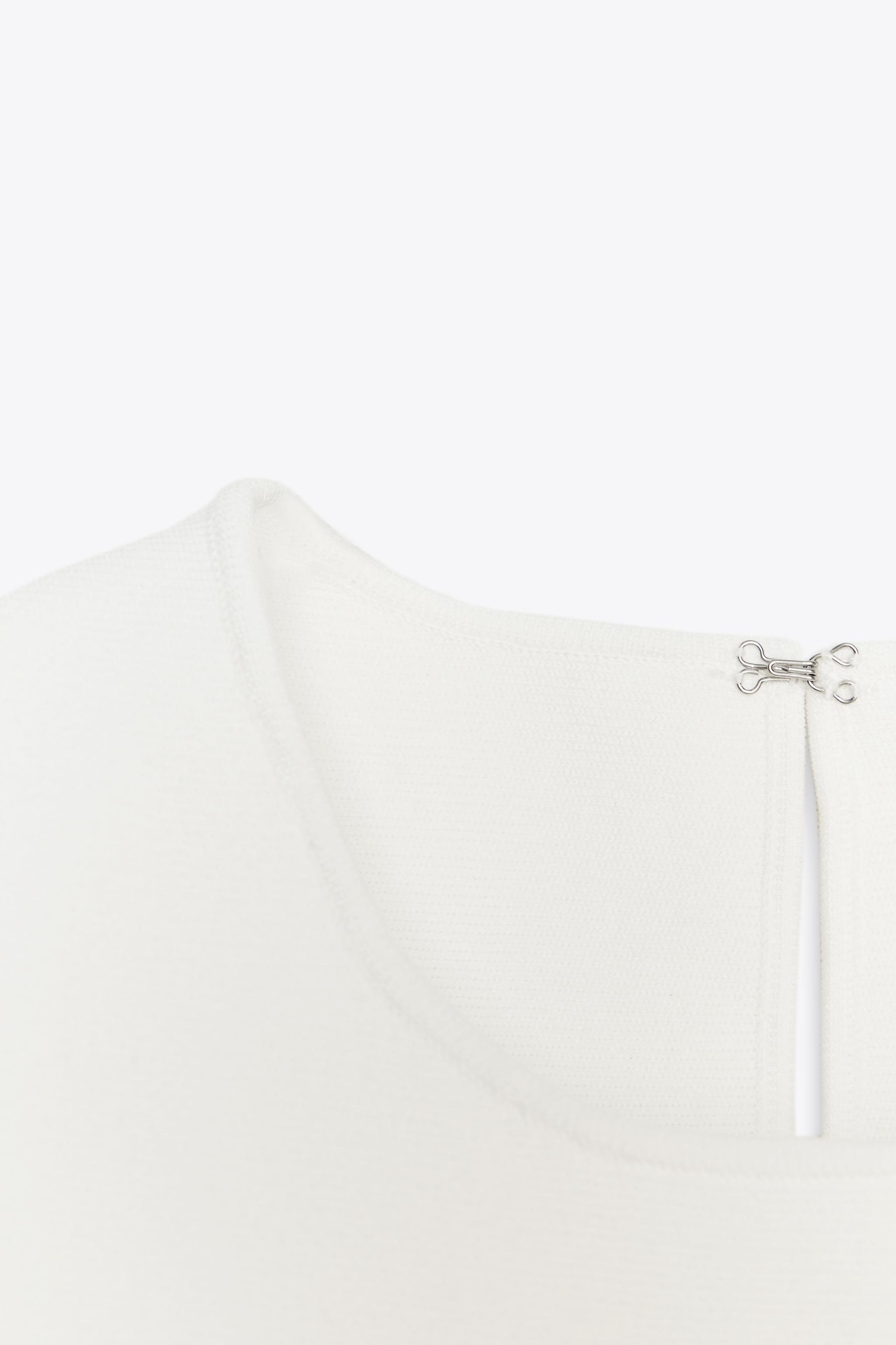 TIE-DETAIL PEPLUM KNIT TOP