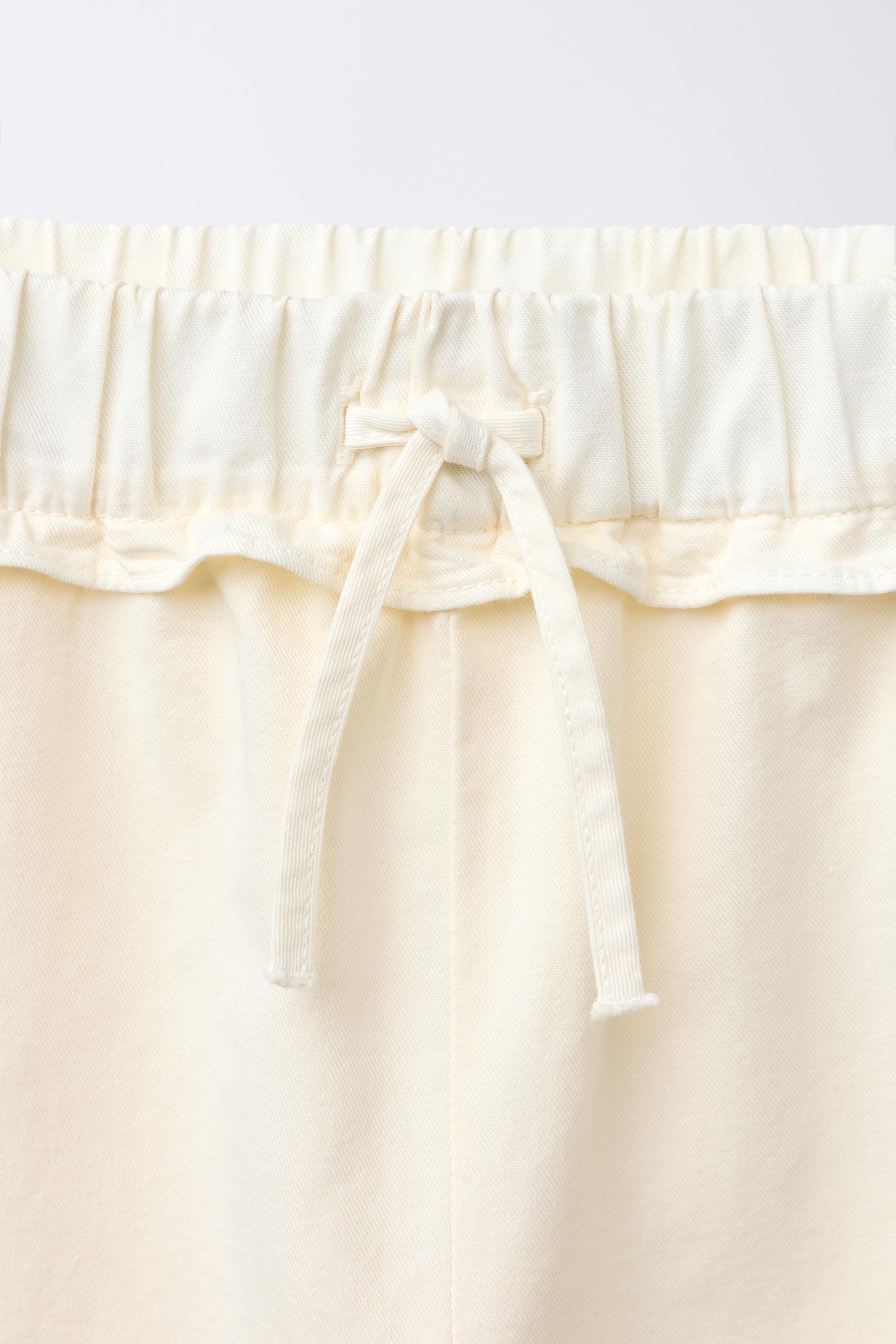 WIDE LEG PANTS WITH CROCHET FLOWER RUFFLES