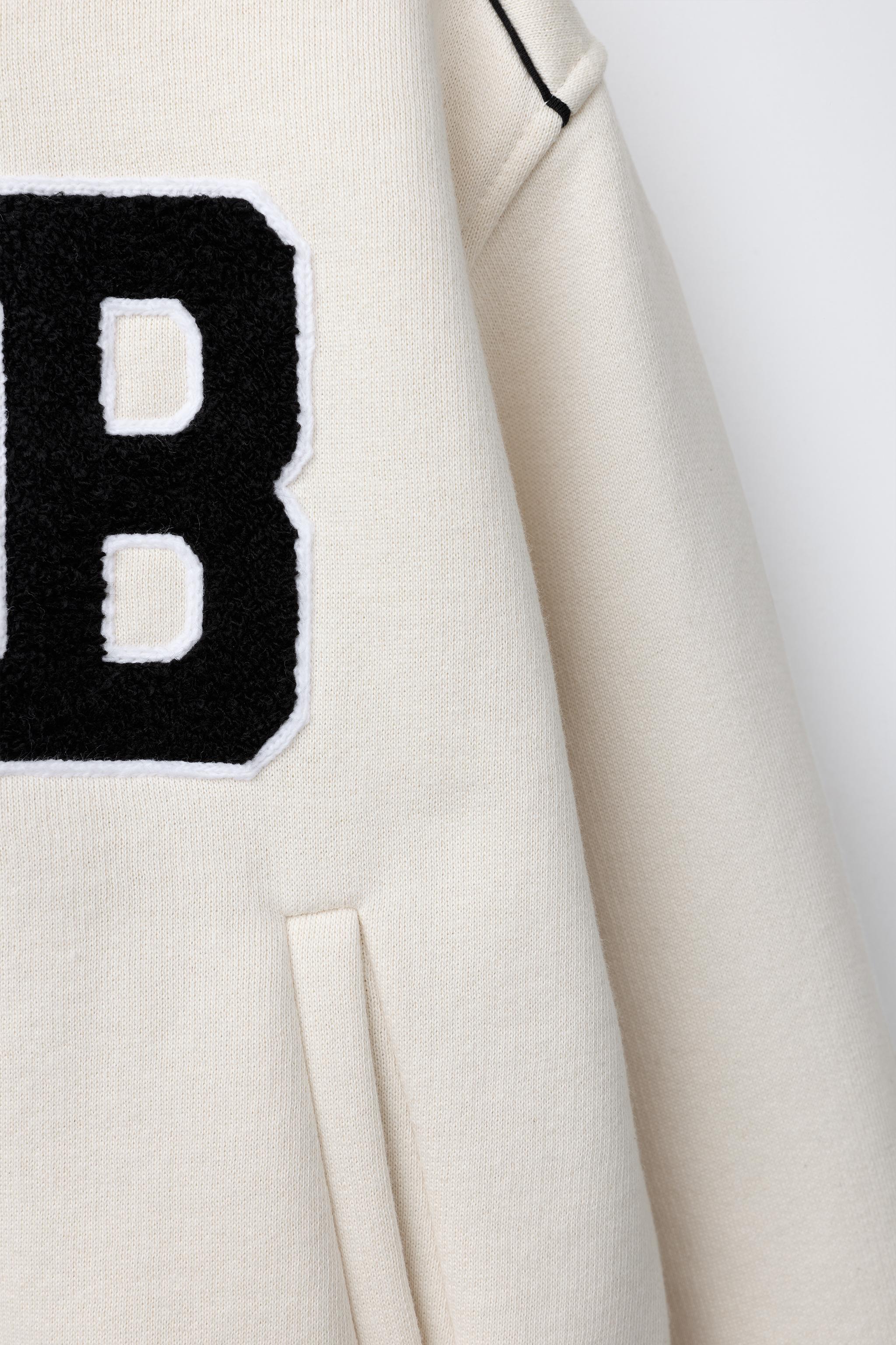 PLUSH BOMBER JACKET WITH EMBROIDERED TEXT