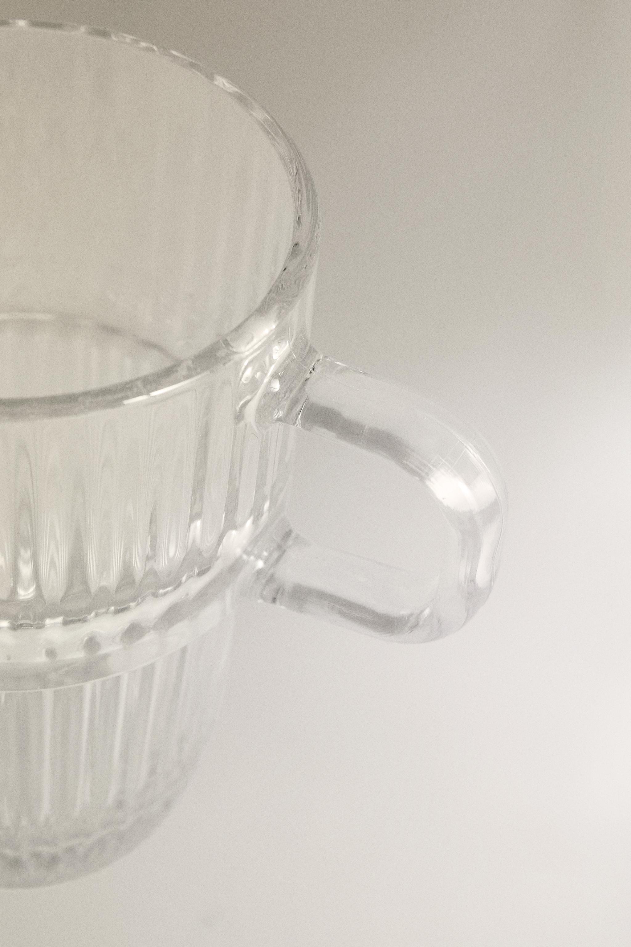 GLASS MUG WITH A RAISED DESIGN