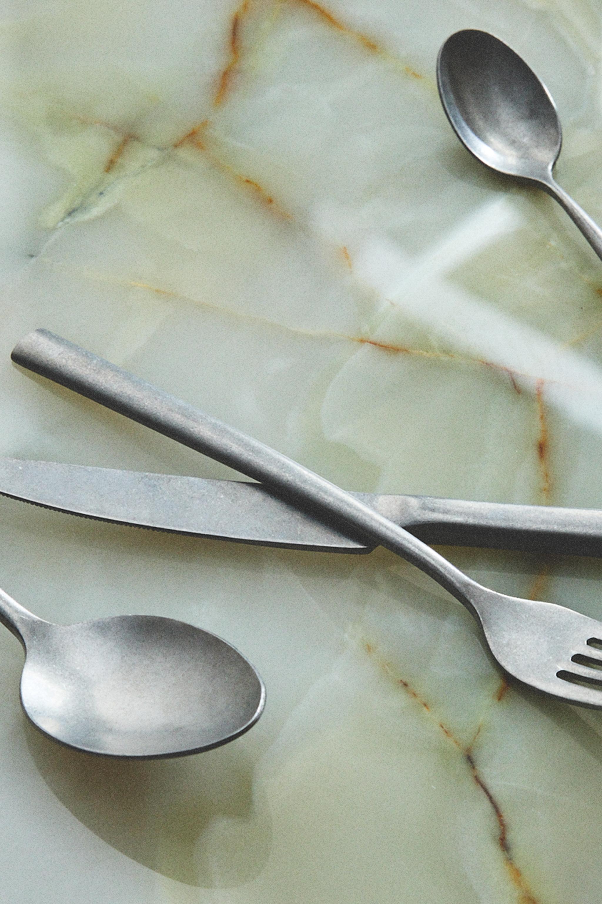 4-PIECE VINTAGE STEEL FLATWARE SET