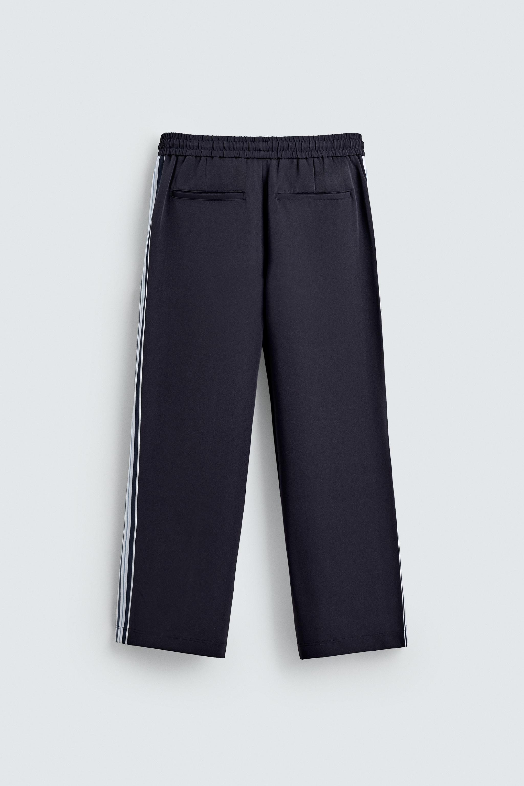 WIDE FIT JOGGER PANTS WITH SIDE STRIPES