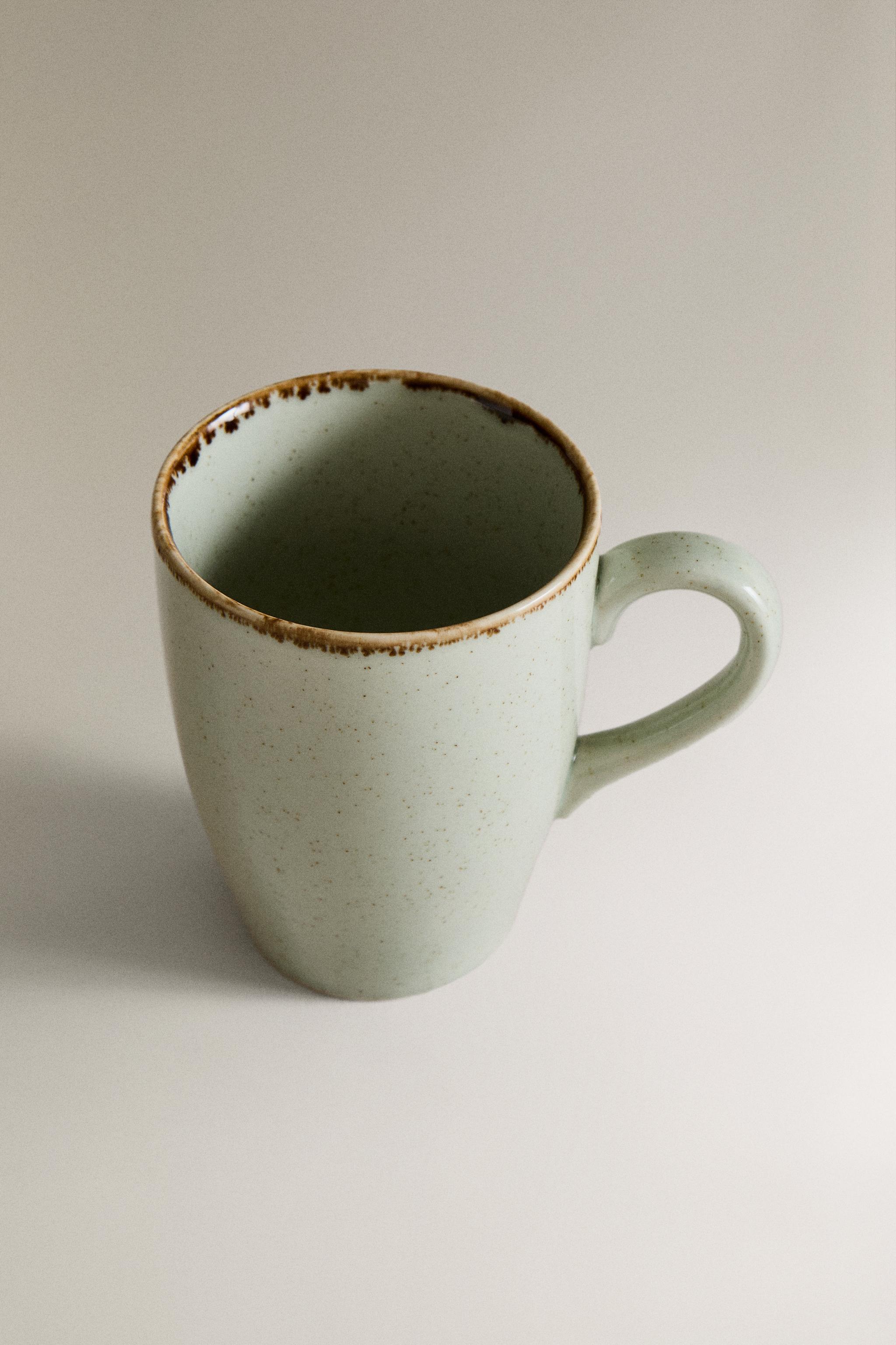 PORCELAIN MUG WITH ANTIQUE FINISH RIM