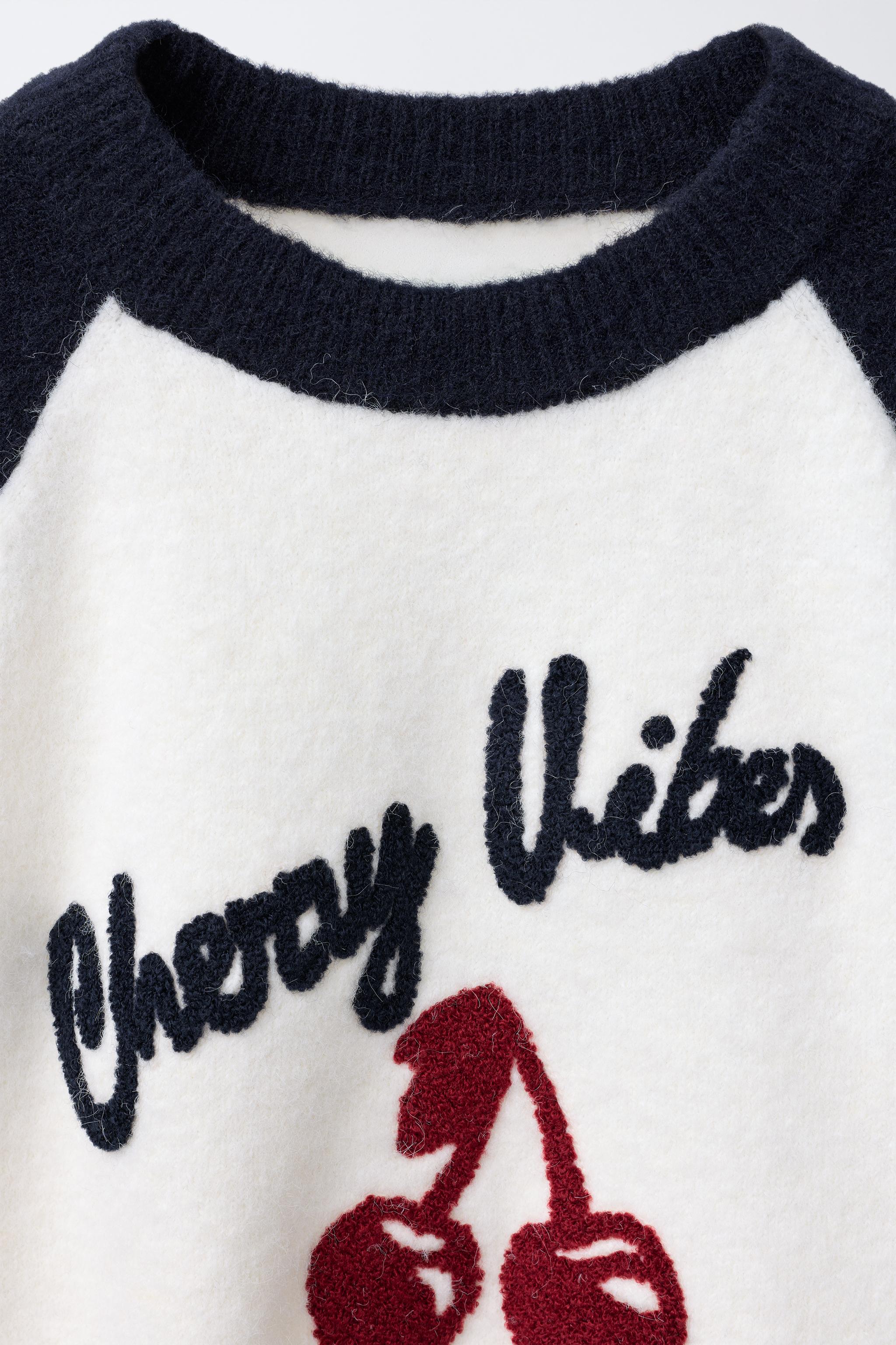 CONTRAST SLEEVE TEXT SWEATER