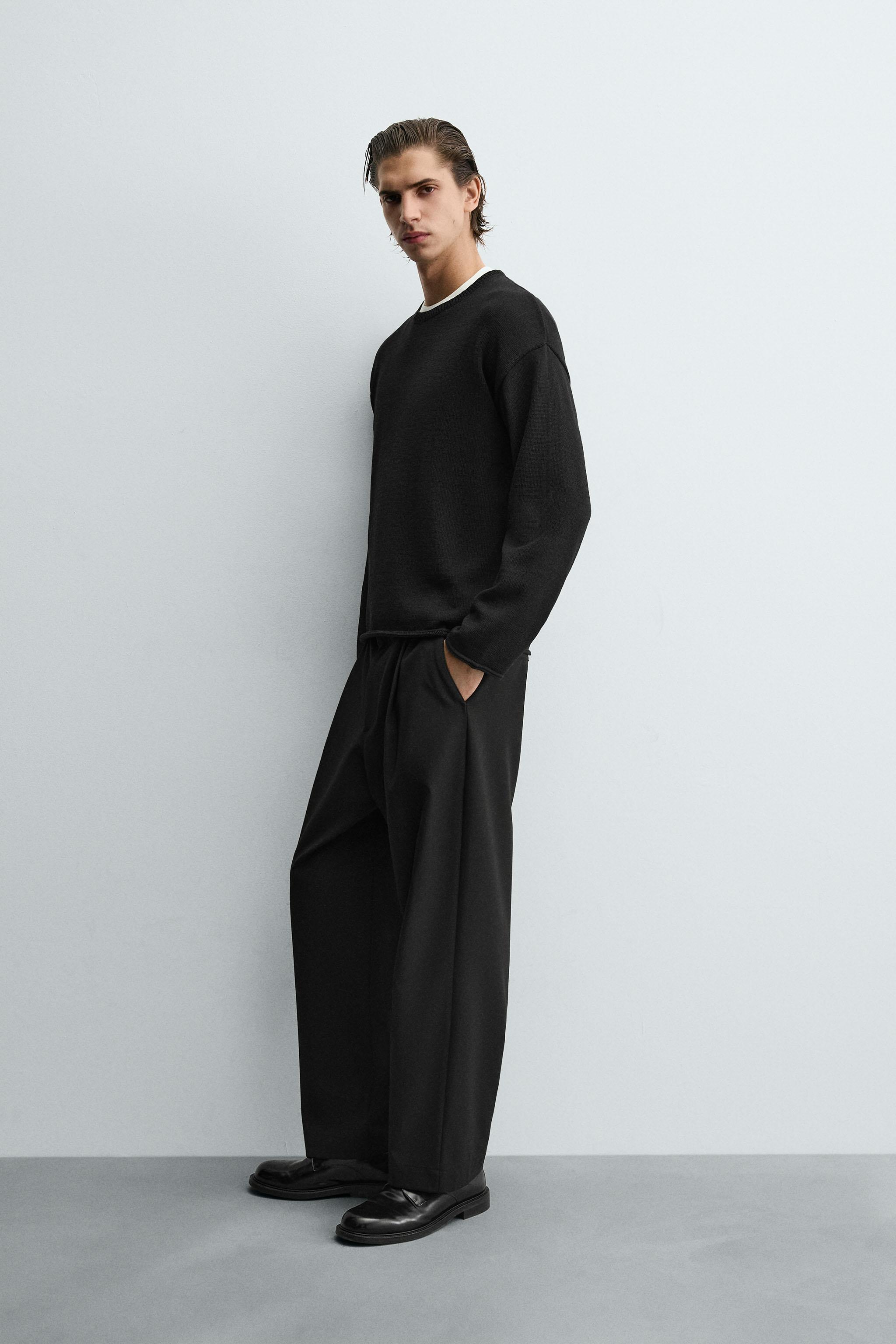 TEXTURED KNIT SWEATER WITH ROLLED TRIM