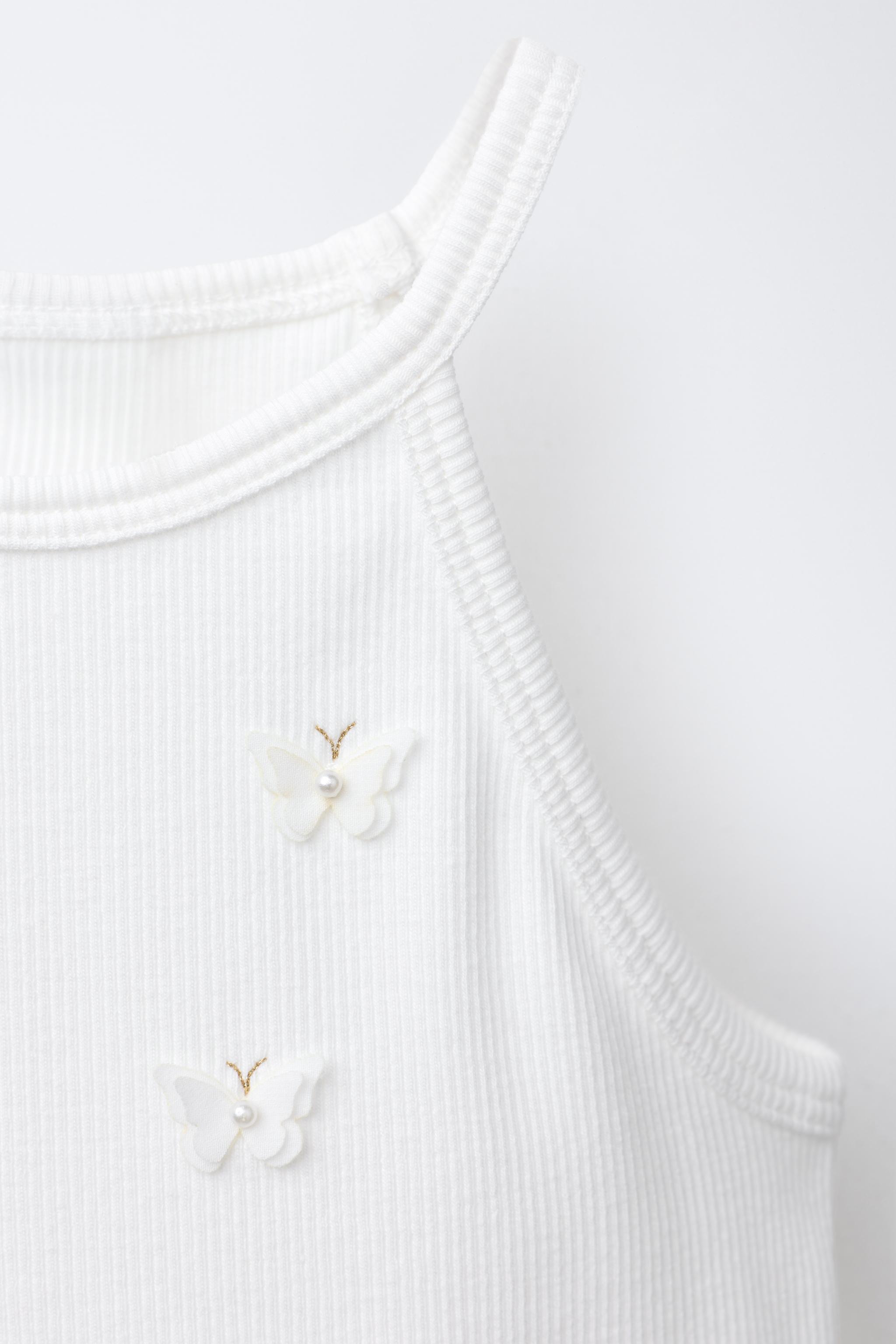 BUTTERFLY AND FLOWER RIBBED TOP