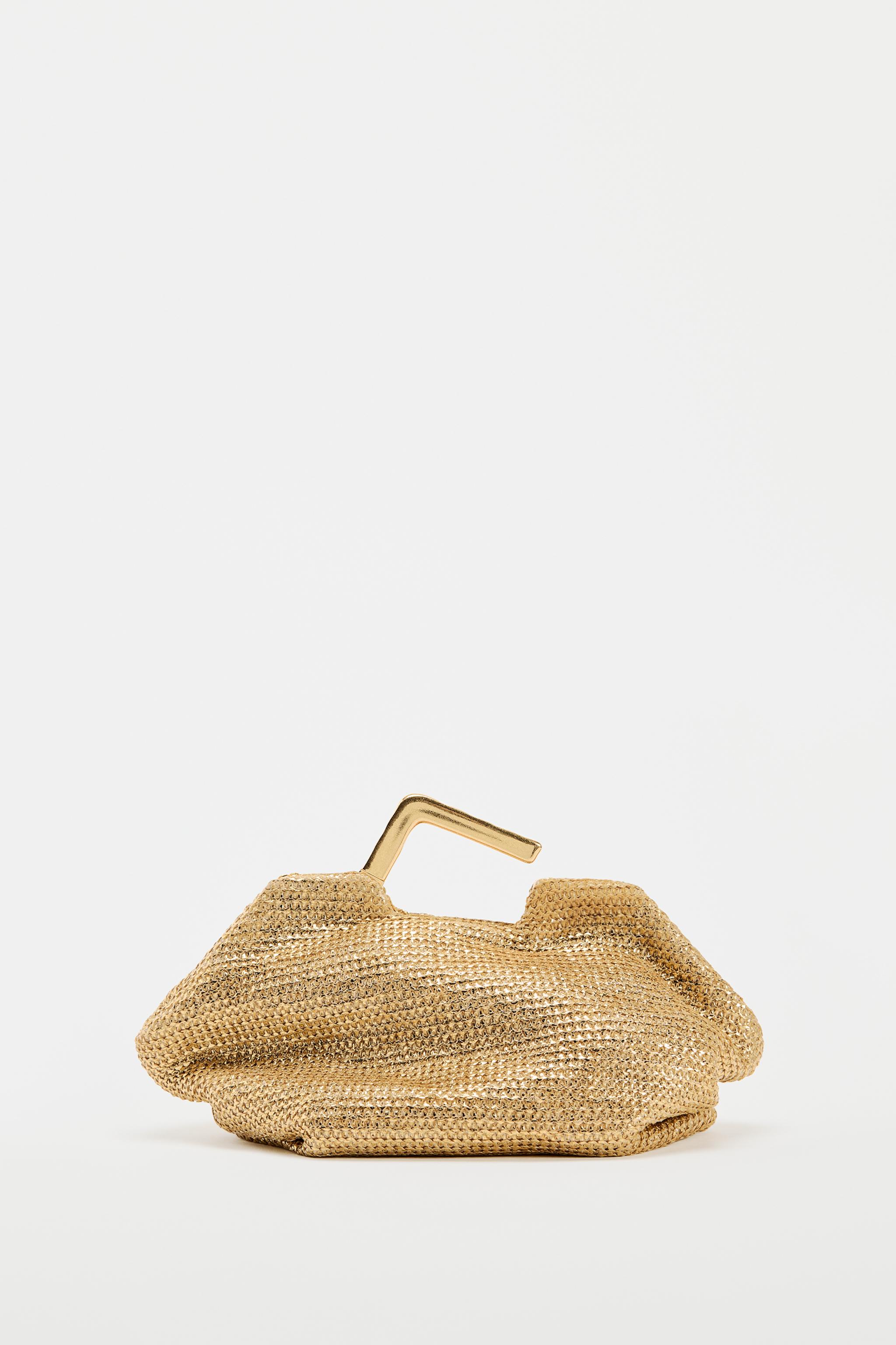 GOLD BAG WITH METAL HANDLE