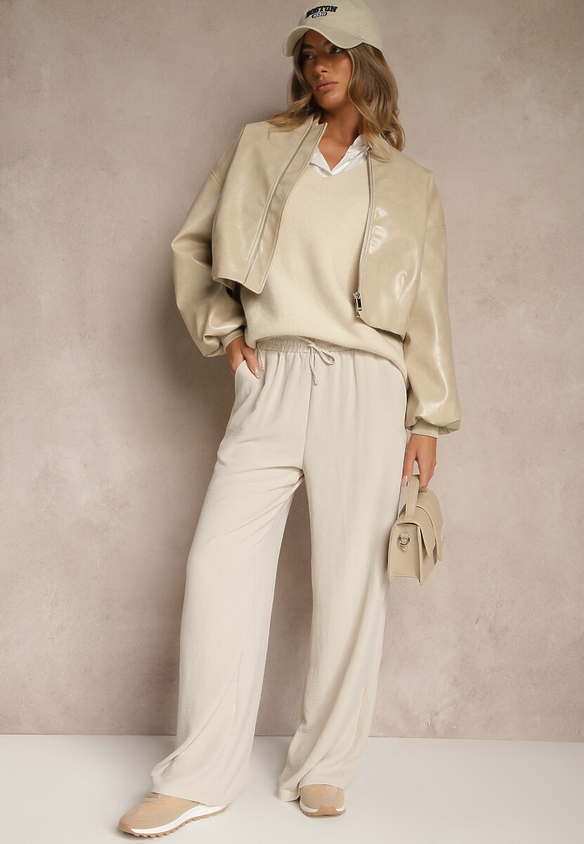 Jasnobeżowe Spodnie Luźne o Szerokich Nogawkach z Łańcuszkiem zamiast Troczka Ostaria