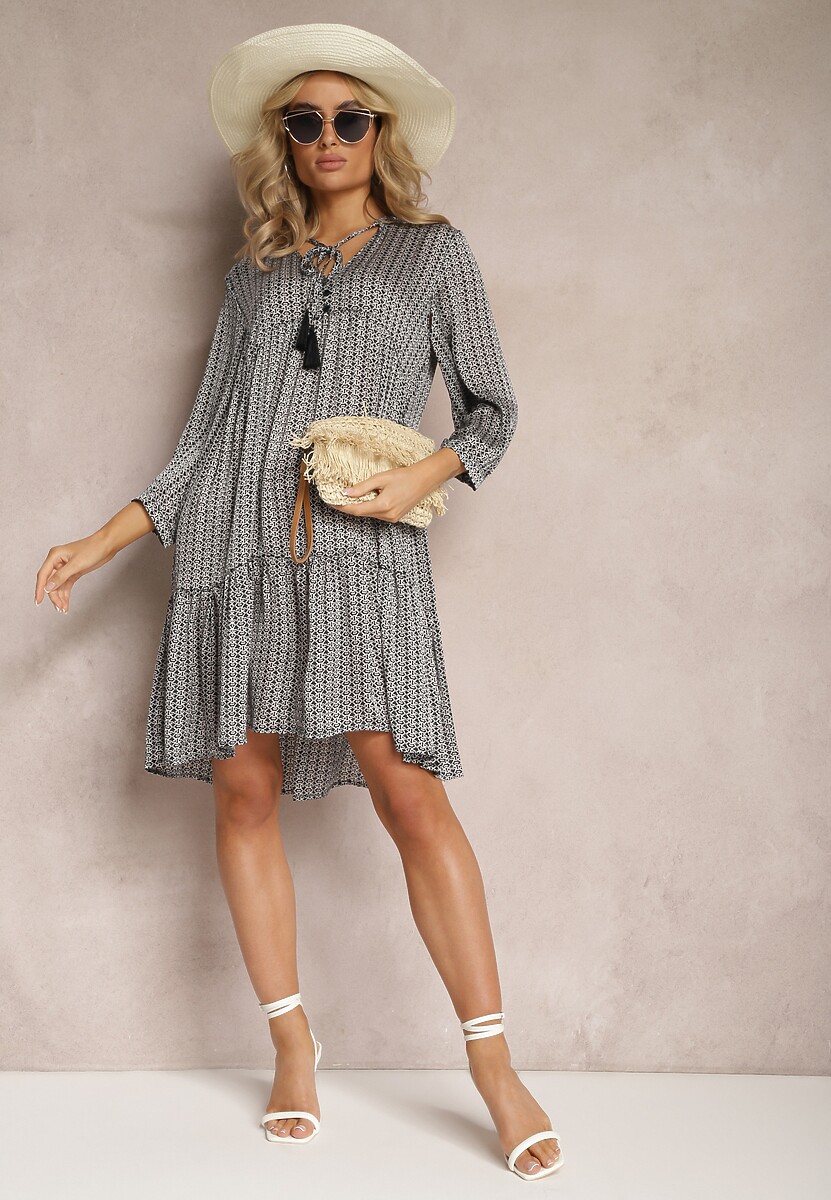 Czarno-Biała Trapezowa Sukienka z Chwostami i Rozkloszowanym Dołem Bleva