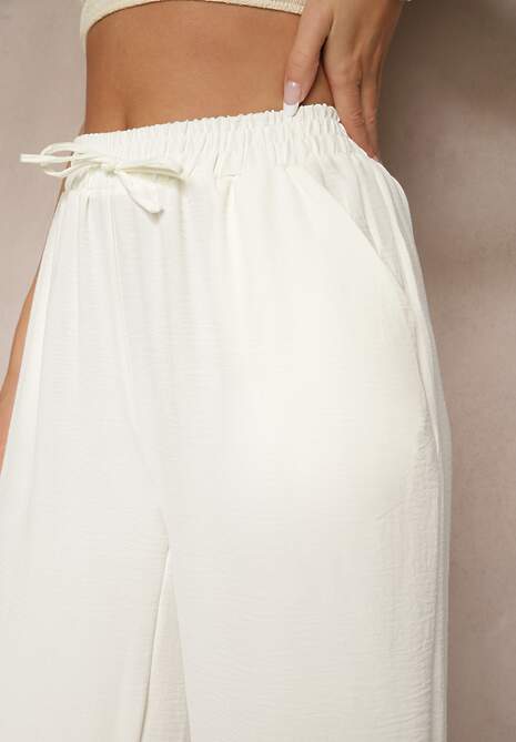 Jasnobeżowe Spodnie Luźne o Szerokich Nogawkach z Łańcuszkiem zamiast Troczka Ostaria