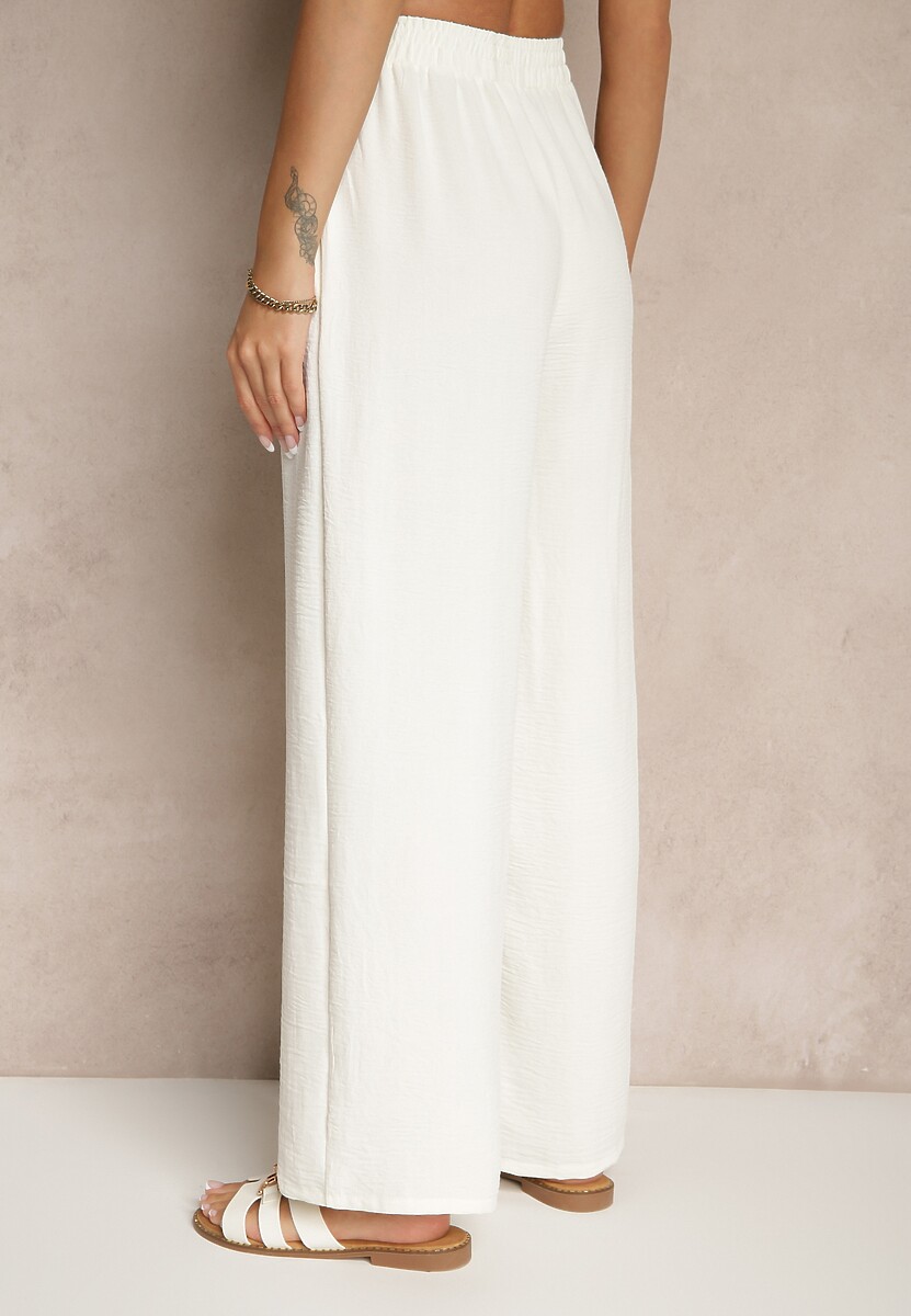 Jasnobeżowe Spodnie Luźne o Szerokich Nogawkach z Łańcuszkiem zamiast Troczka Ostaria