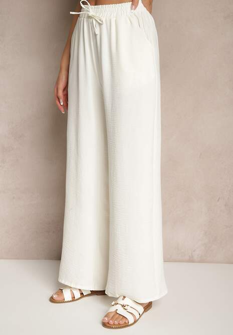 Jasnobeżowe Spodnie Luźne o Szerokich Nogawkach z Łańcuszkiem zamiast Troczka Ostaria
