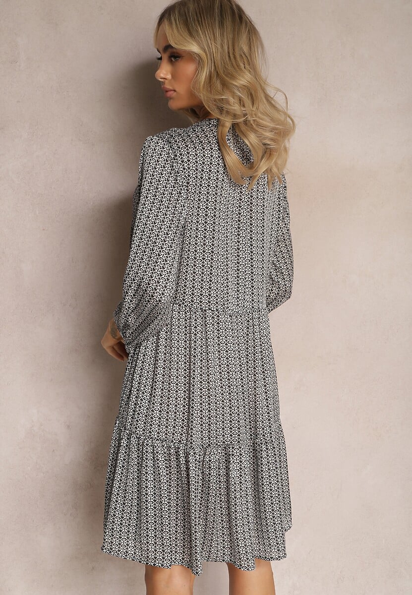 Czarno-Biała Trapezowa Sukienka z Chwostami i Rozkloszowanym Dołem Bleva