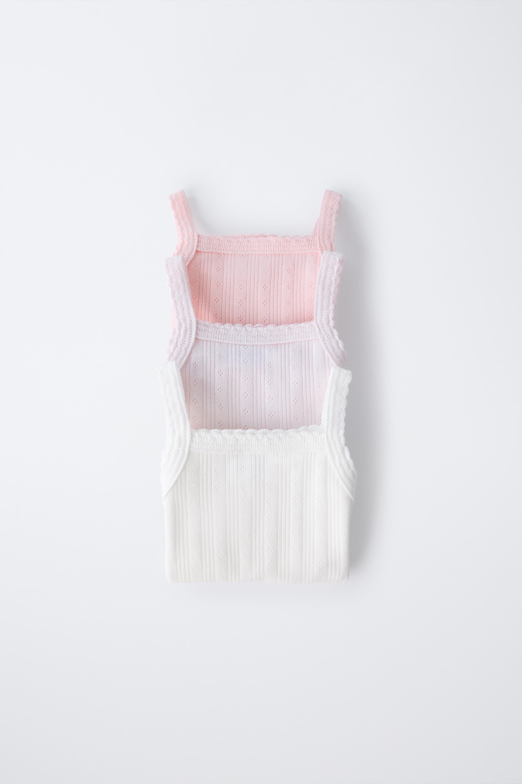 THREE-PACK OF RIB KNIT BODYSUITS WITH CUTOUT DETAIL