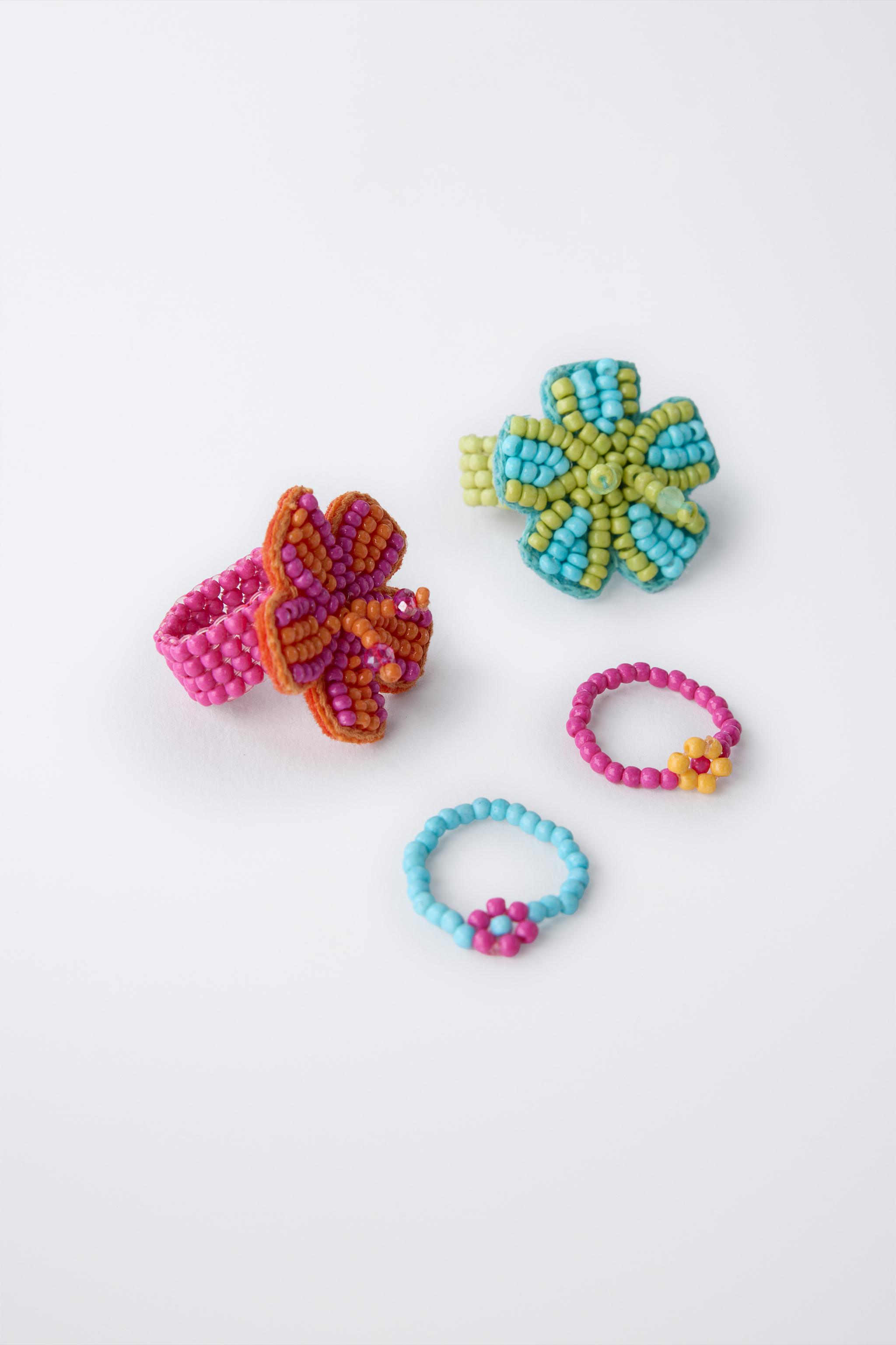 FOUR-PACK OF BEADED FLOWER RINGS