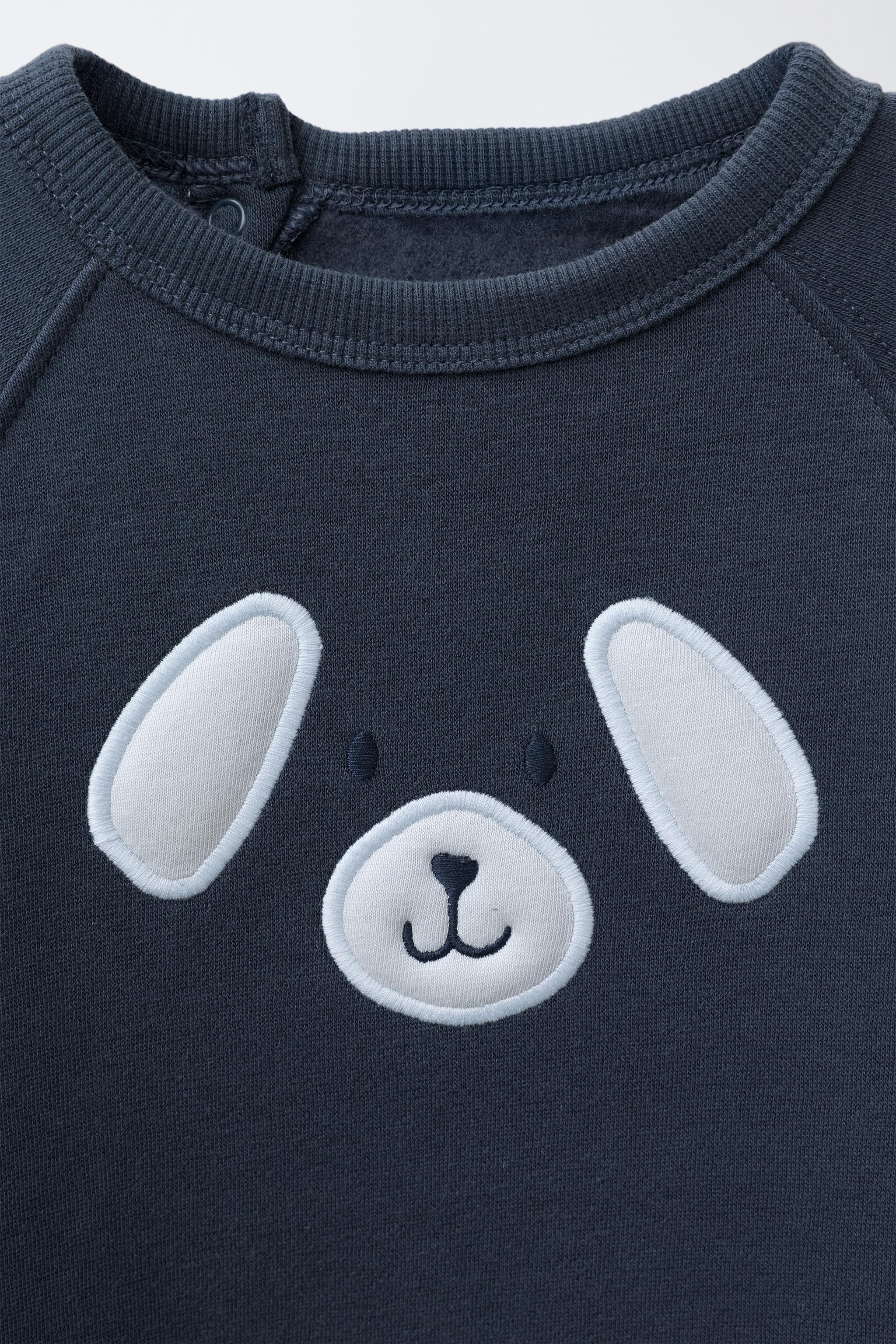 EMBROIDERED PUPPY PLUSH JUMPSUIT