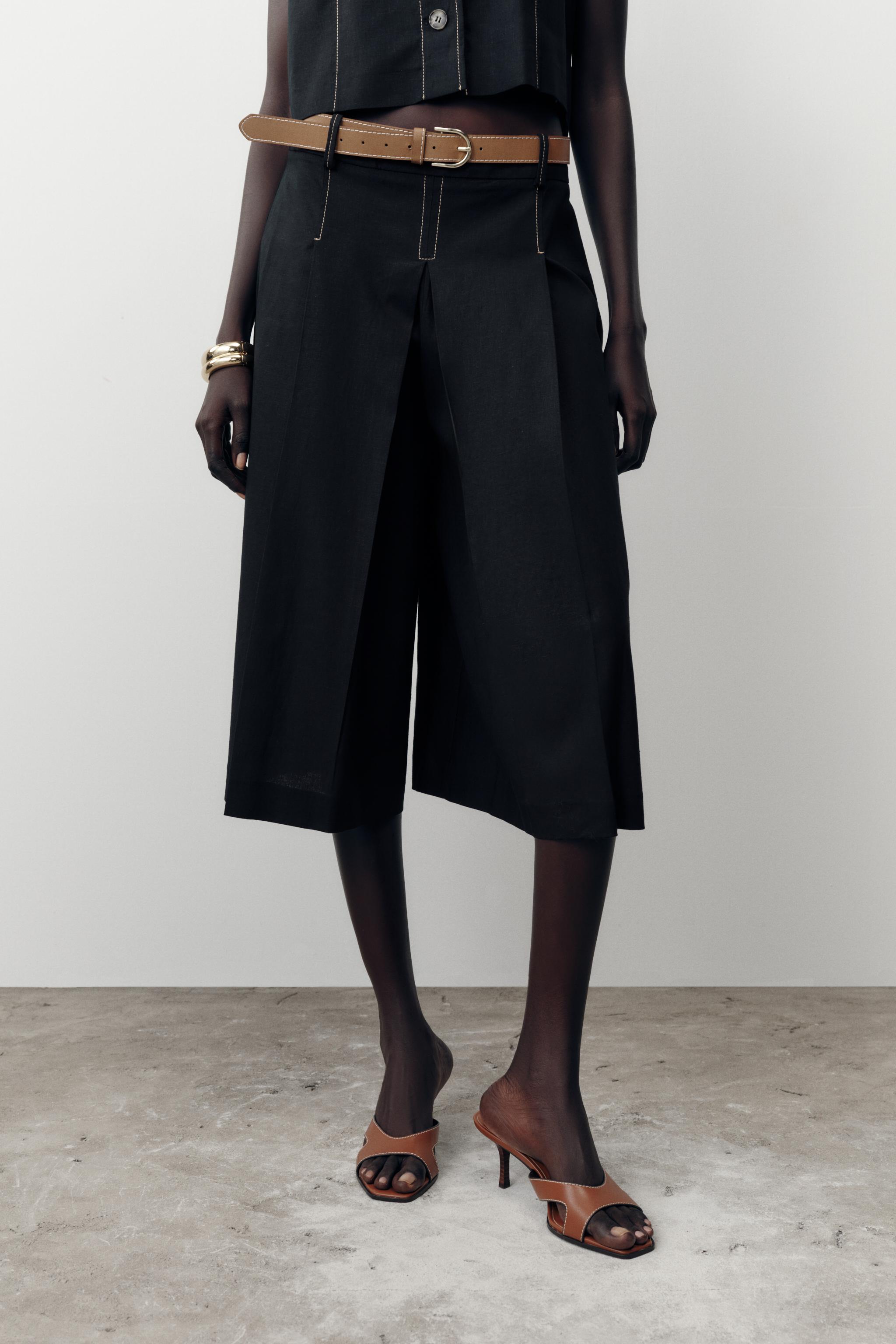 BELTED LONG PLEATED SHORTS