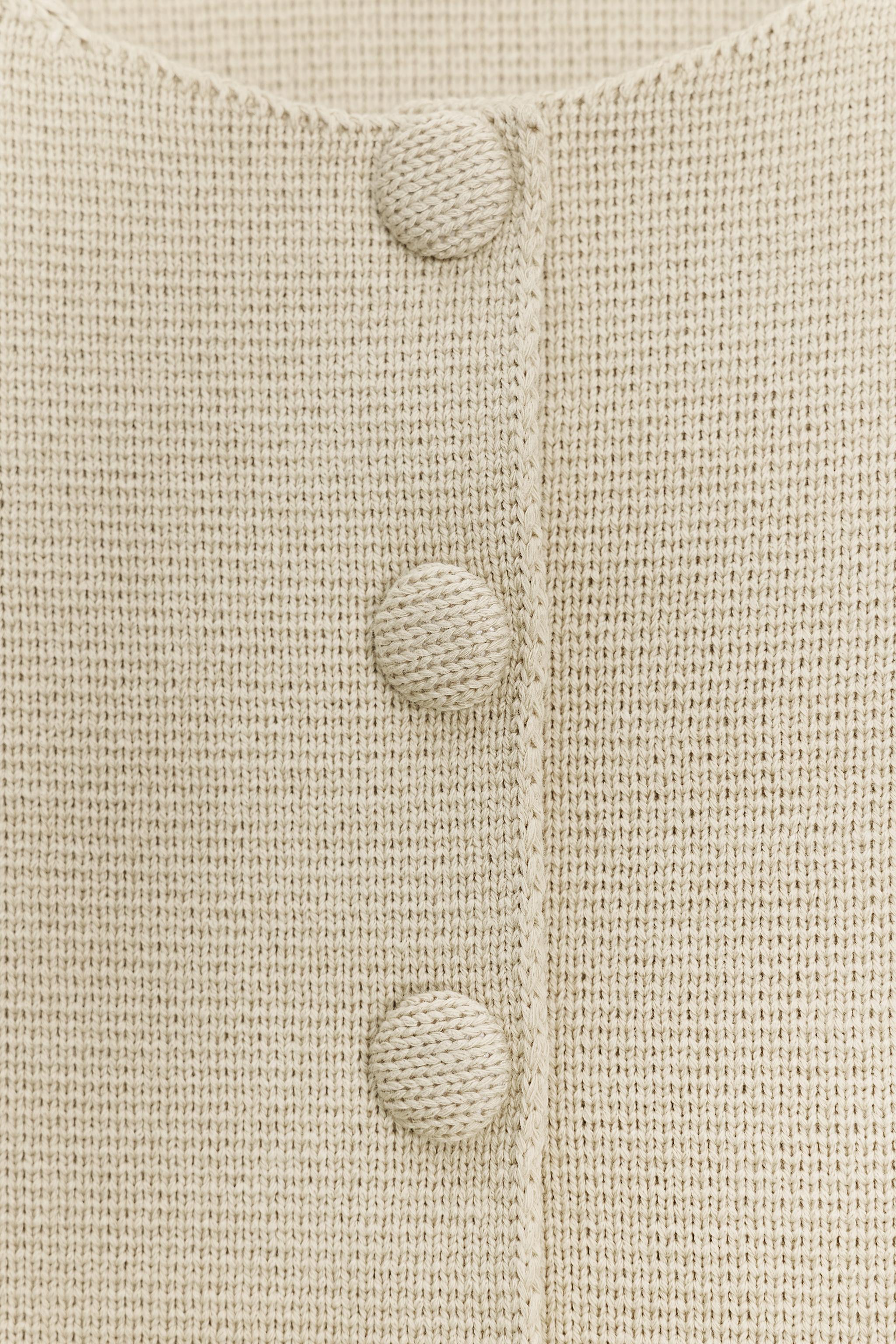 PEPLUM SHORT SLEEVE CARDIGAN