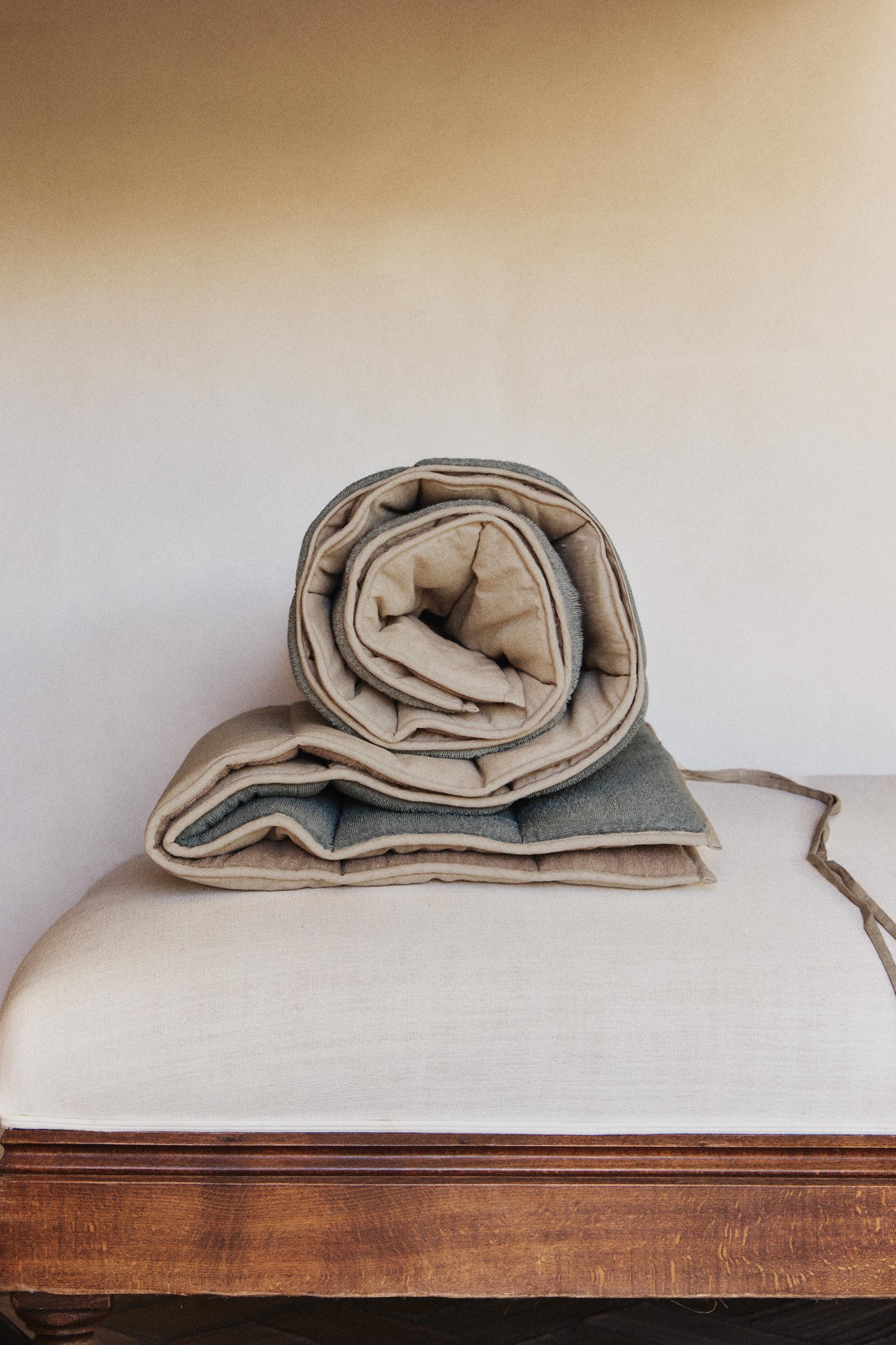 QUILTED TOPPER MADE OF TOWEL FABRIC