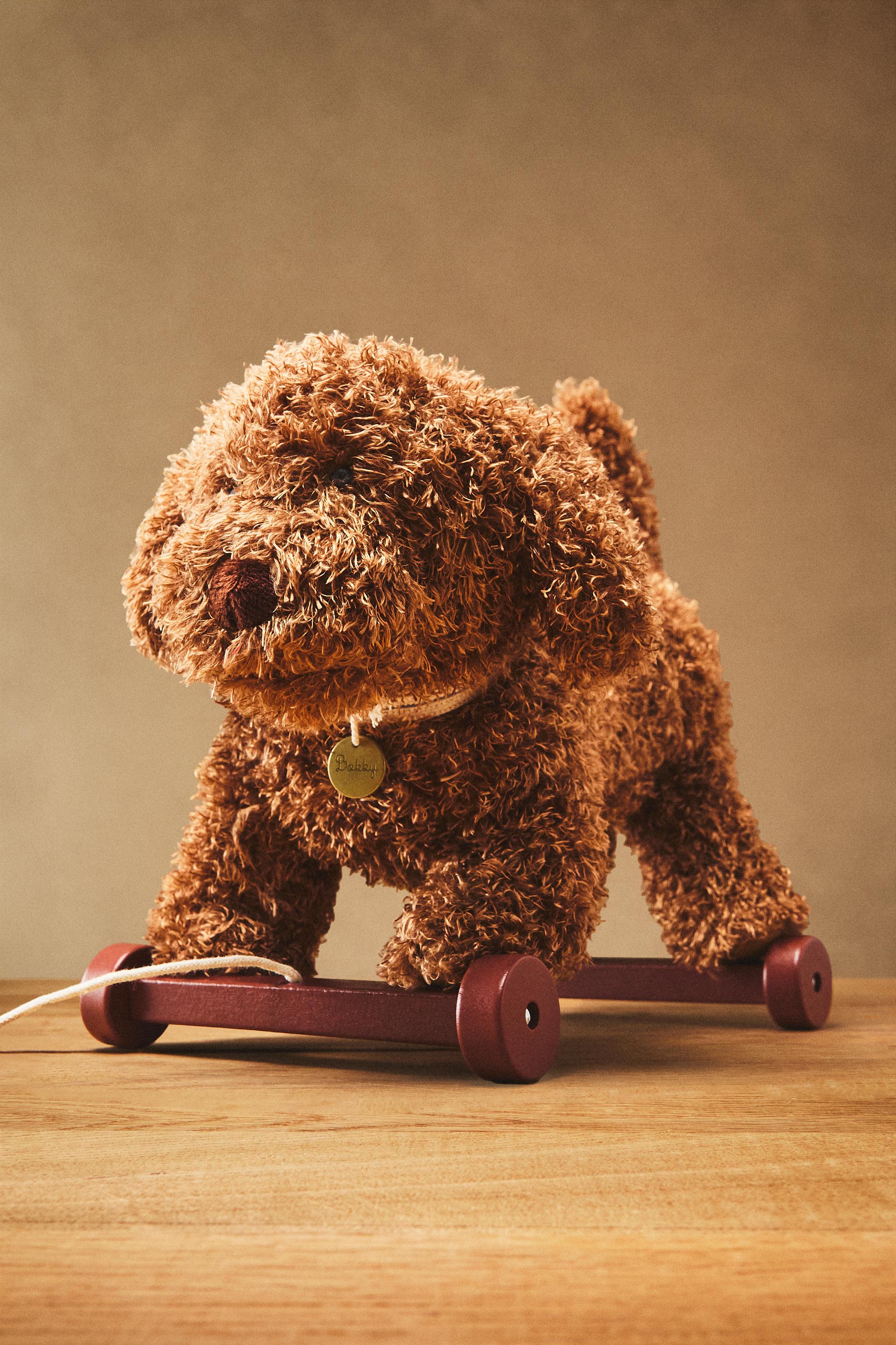 CHILDREN'S PLUSH TOY DOG WITH WHEELS